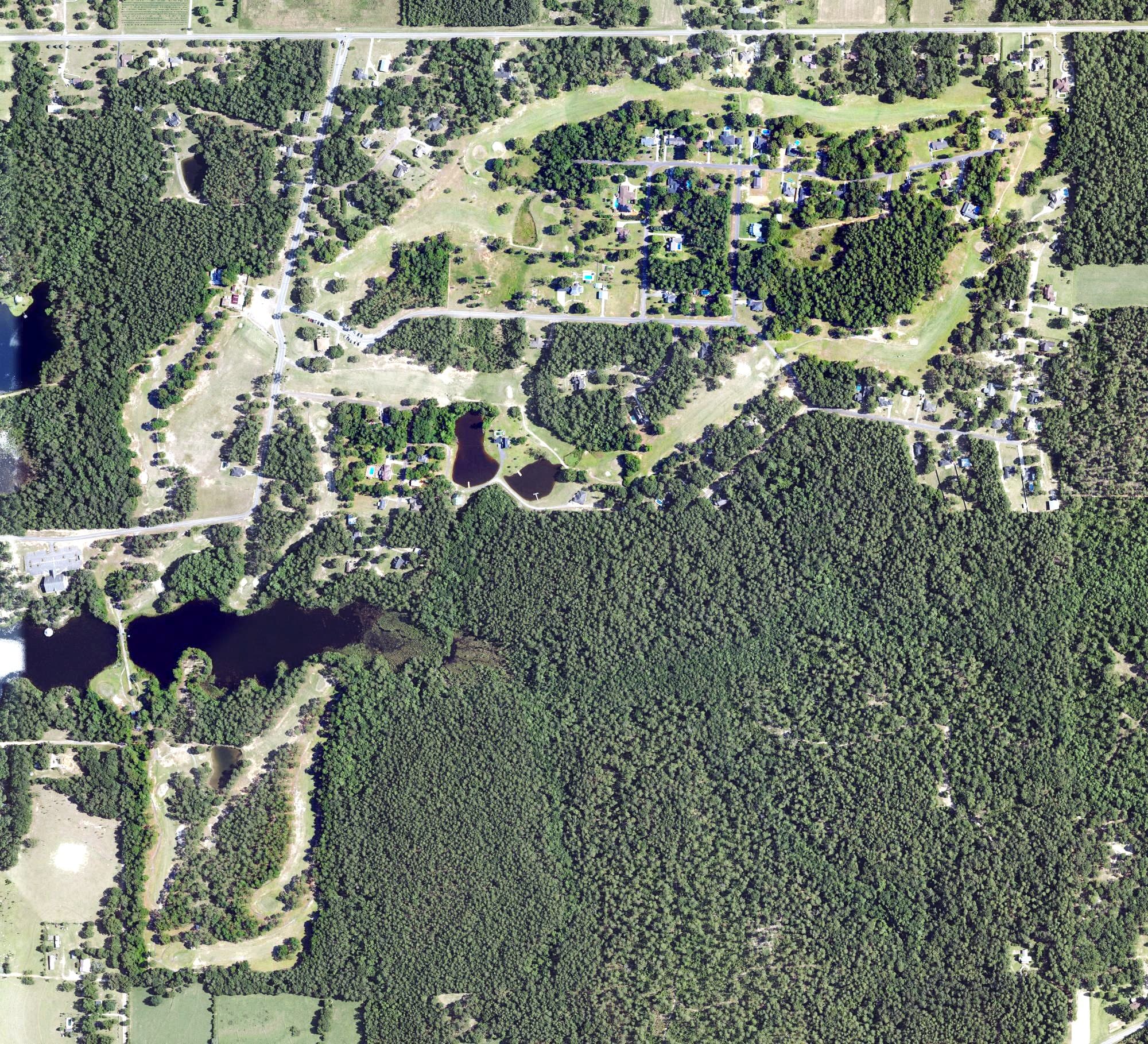 Aerial view of Mill Creek Golf Course, AL, with its hole routing marked