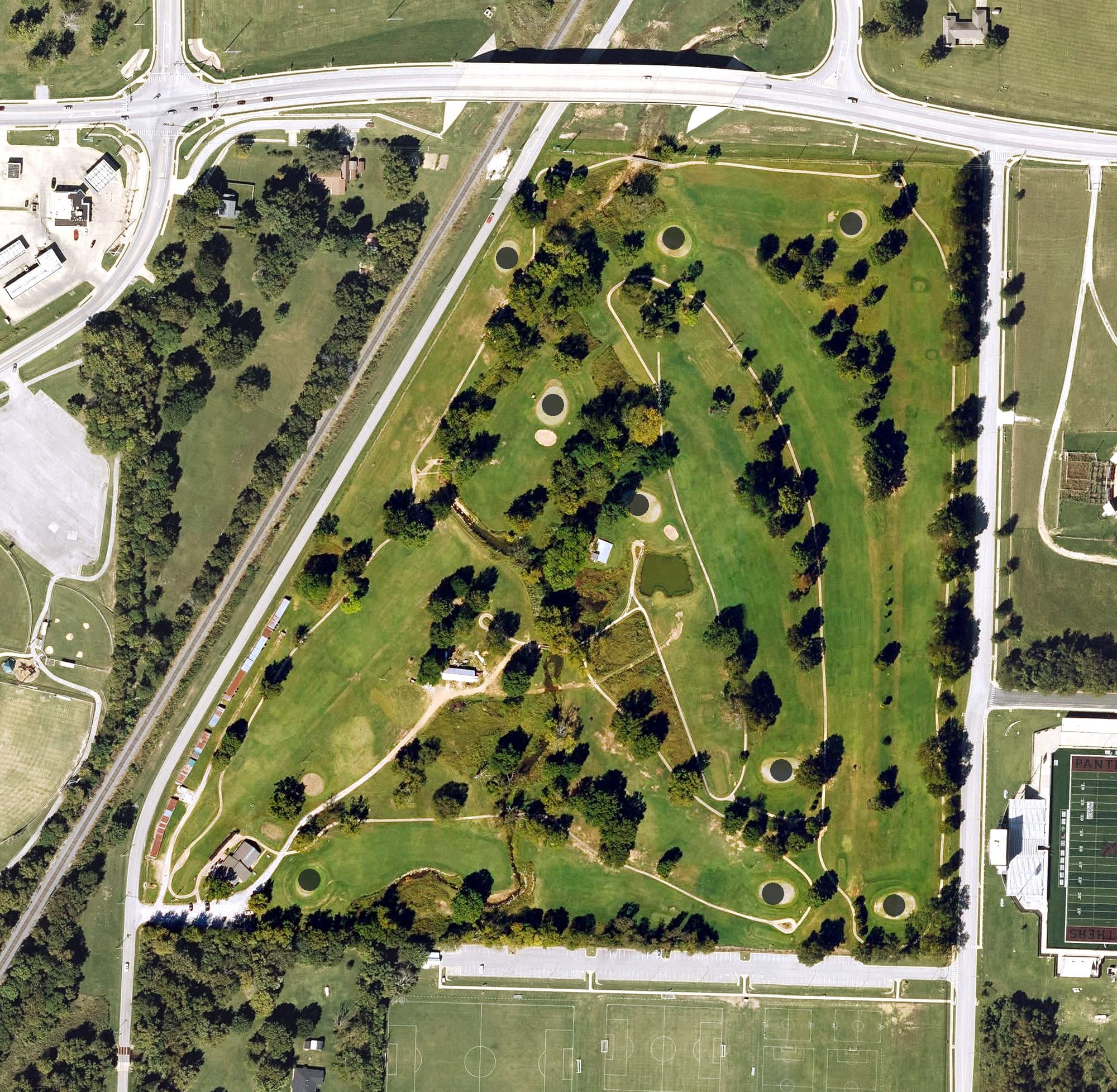 Aerial view of Siloam Springs Country Club, AR, with its hole routing marked