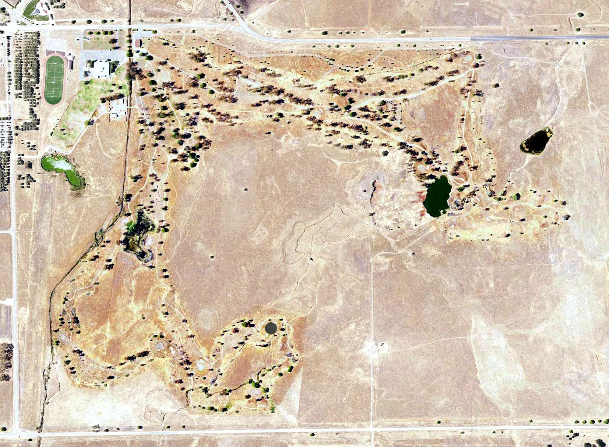 Aerial view of Coyote Run Golf Course, CA, with its hole routing marked