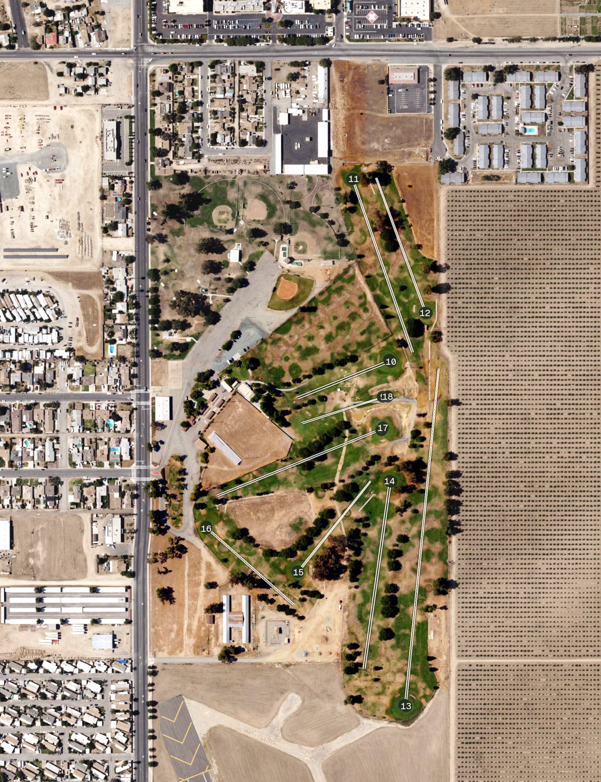 Aerial view of Delano Public Golf Course, CA, with its hole routing marked