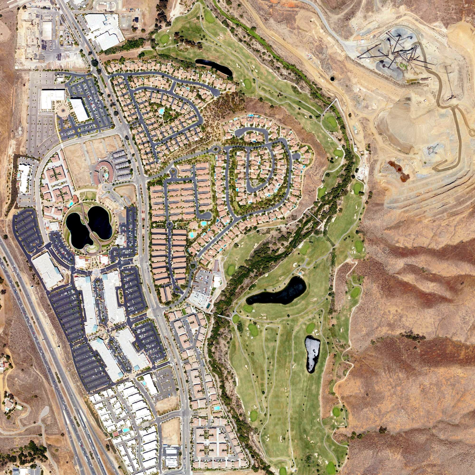 Aerial view of Dos Lagos Golf Course, CA, with its hole routing marked