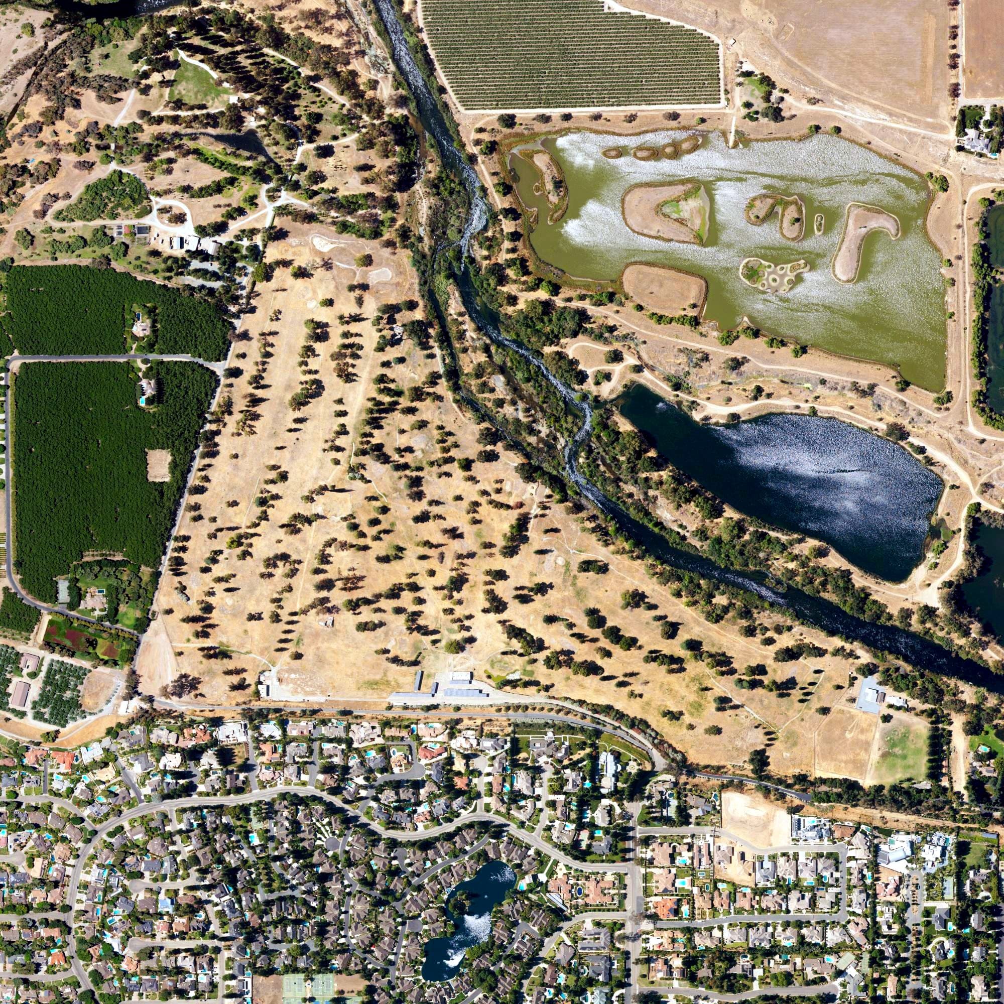Aerial view of Fig Garden Golf Club, CA, with its hole routing marked