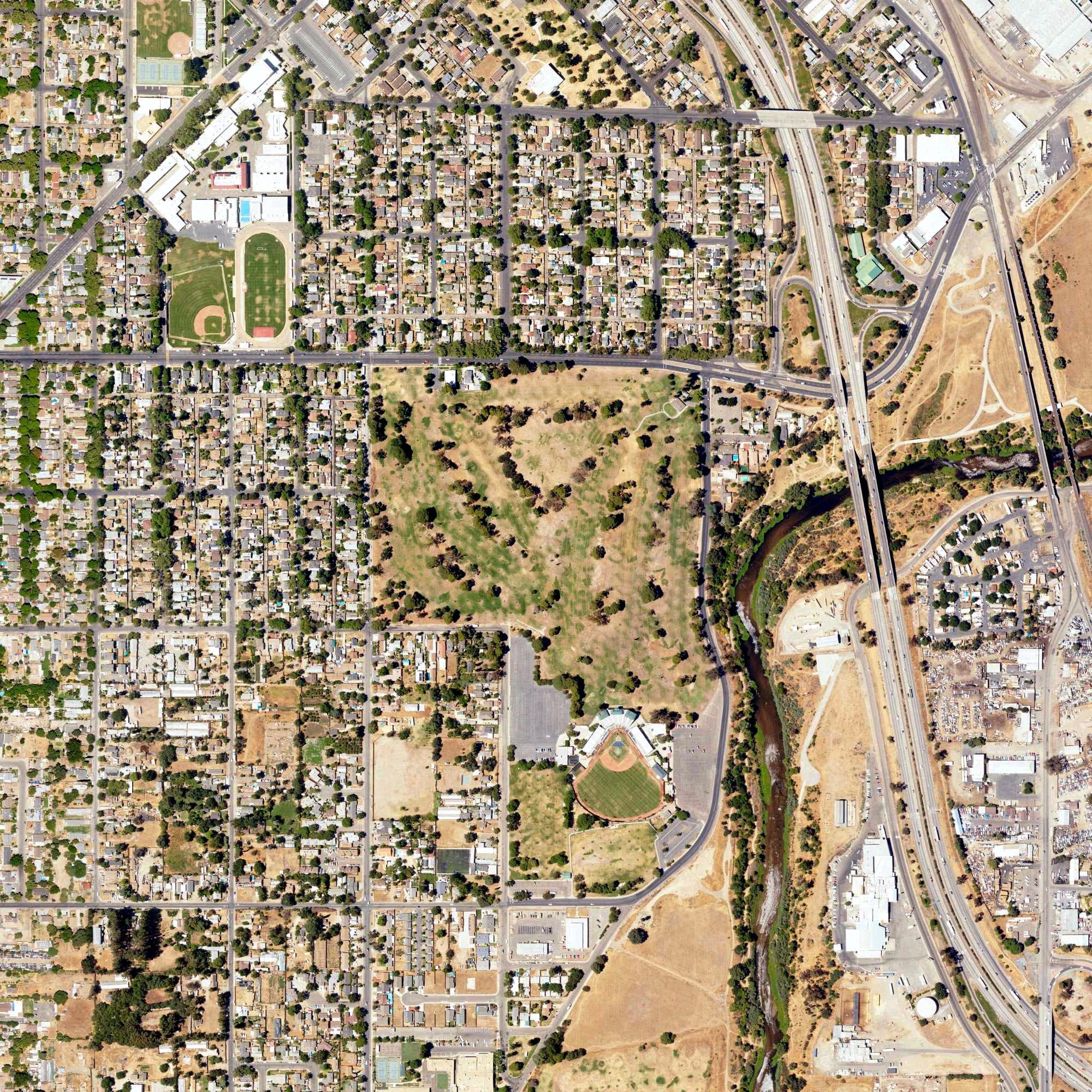Aerial view of Modesto Municipal Golf Course, CA, with its hole routing marked