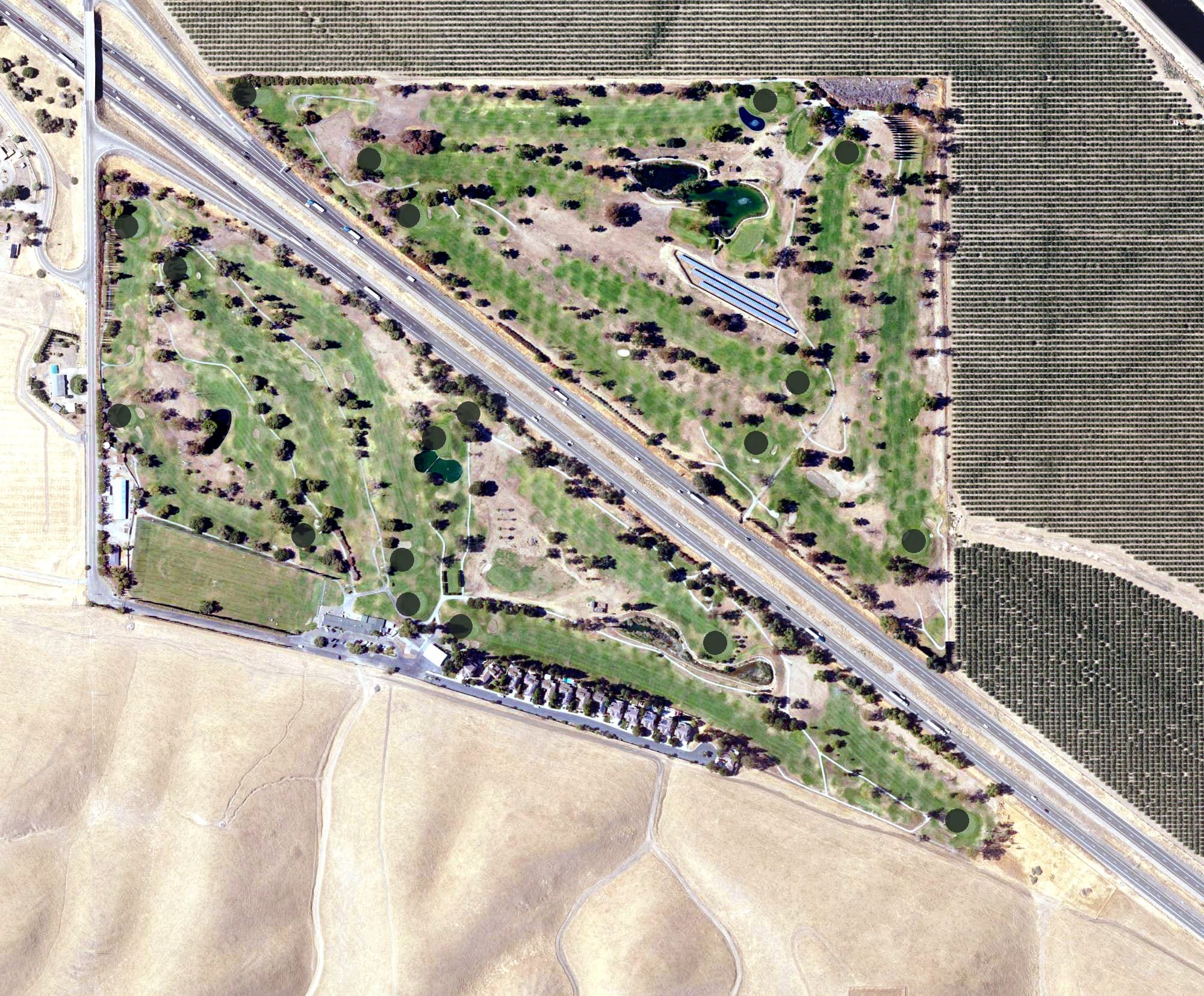 Aerial view of Tracy Golf & Country Club, CA, with its hole routing marked