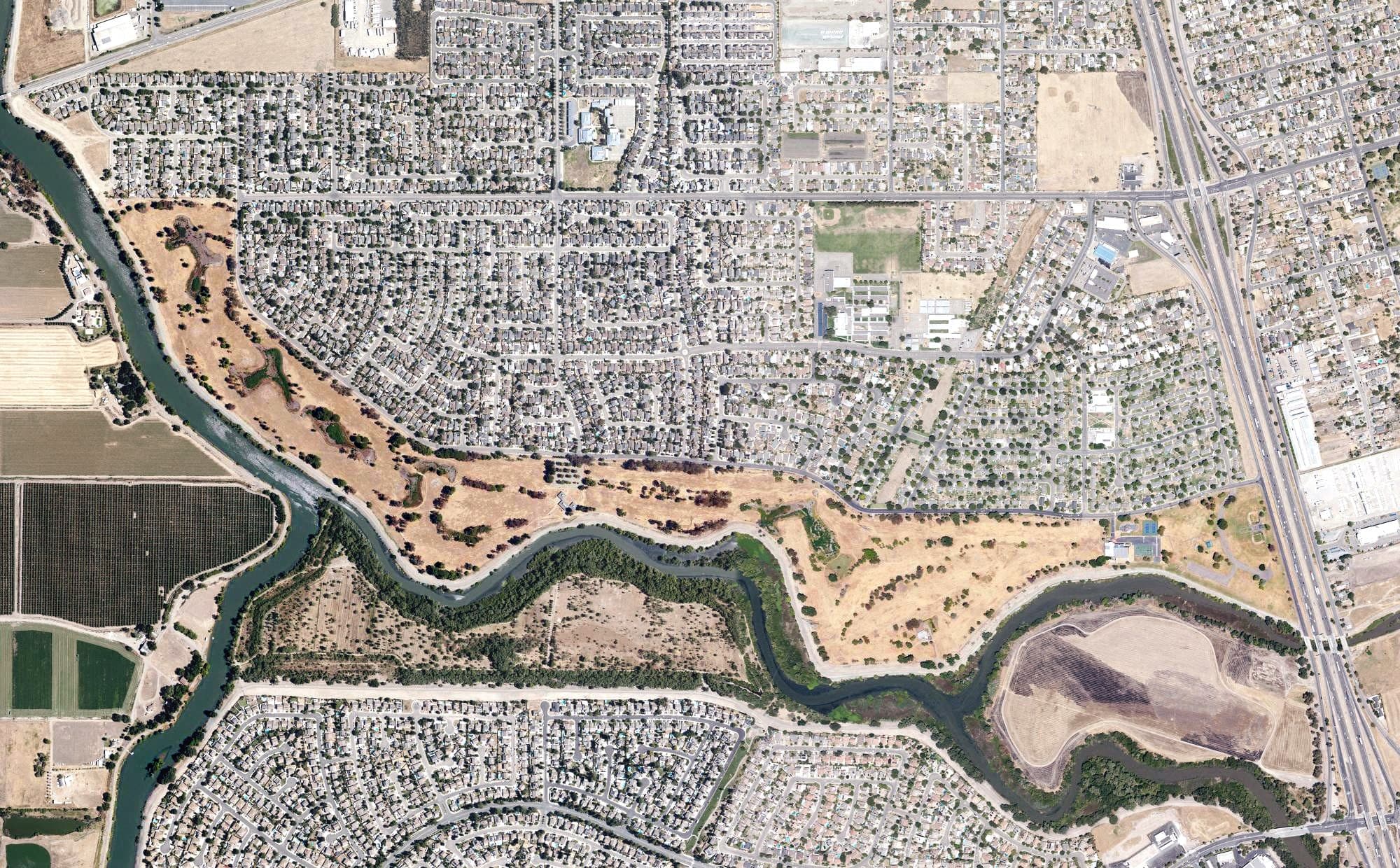 Aerial view of Van Buskirk Municipal Golf Course, CA, with its hole routing marked