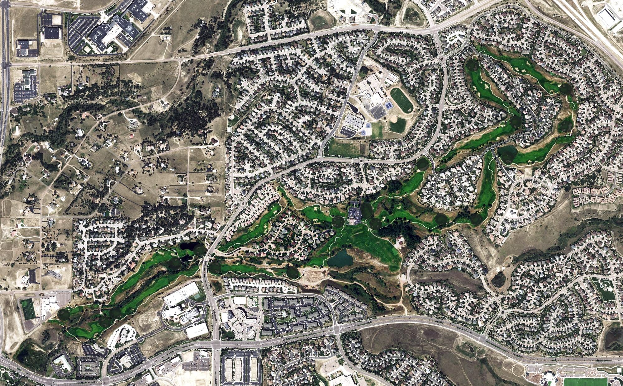 Aerial view of Pine Creek Golf Course, CO, with its hole routing marked