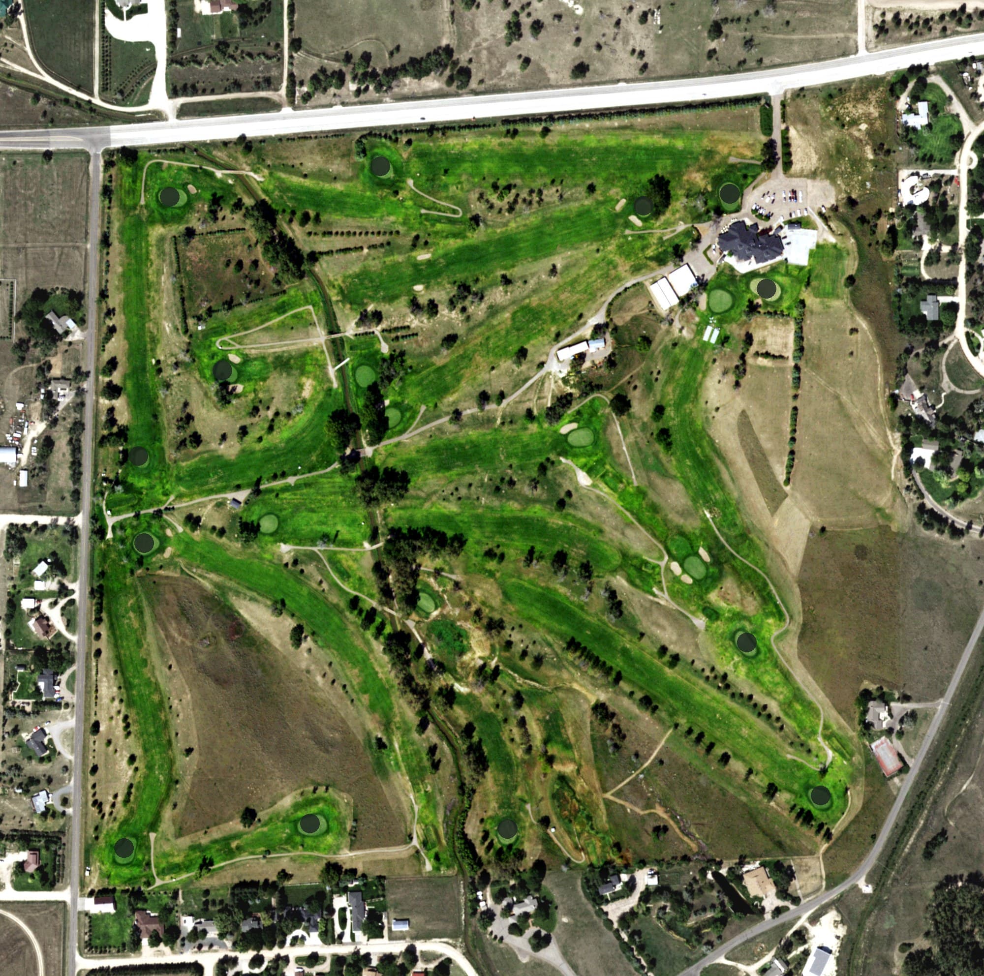Aerial view of Sterling Country Club, CO, with its hole routing marked
