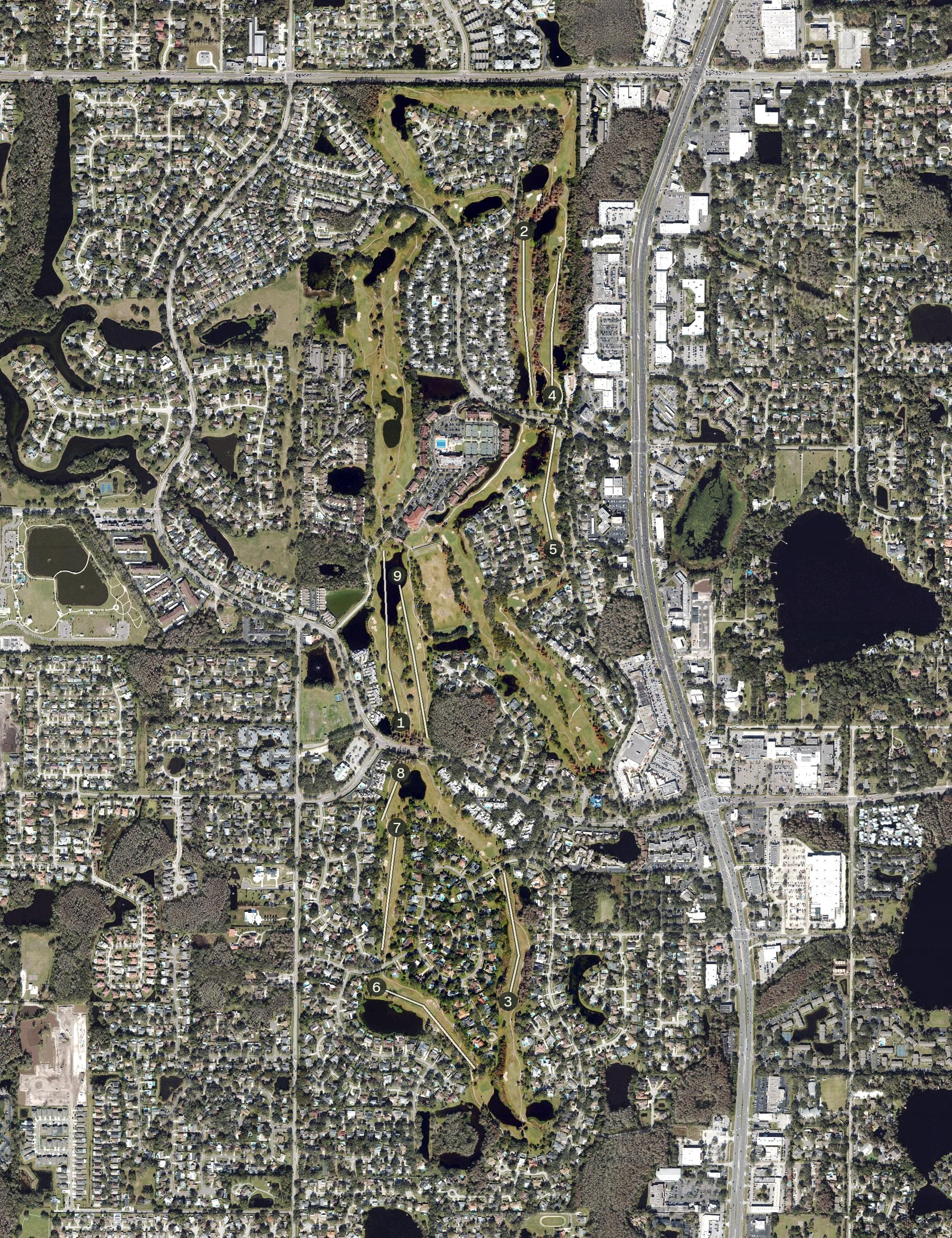 Aerial view of Carrollwood Country Club, FL, with its hole routing marked