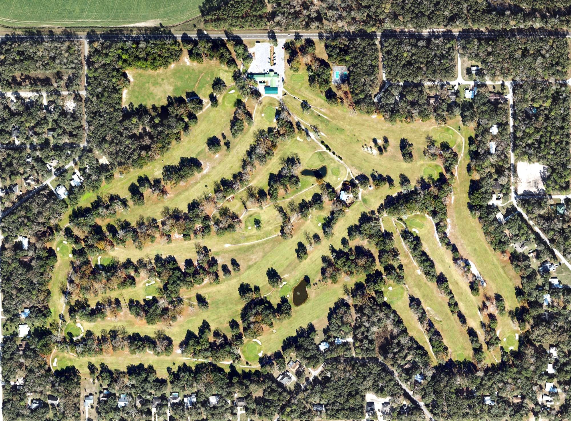 Aerial view of Chiefland Golf & Country Club, FL, with its hole routing marked