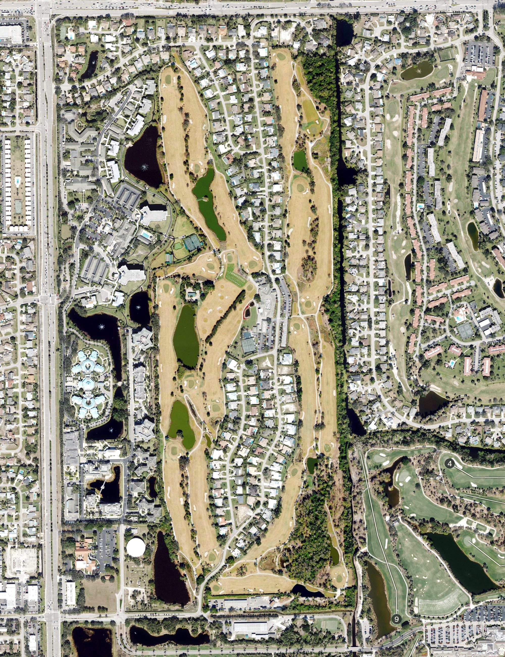 Aerial view of Country Club of Naples, FL, with its hole routing marked
