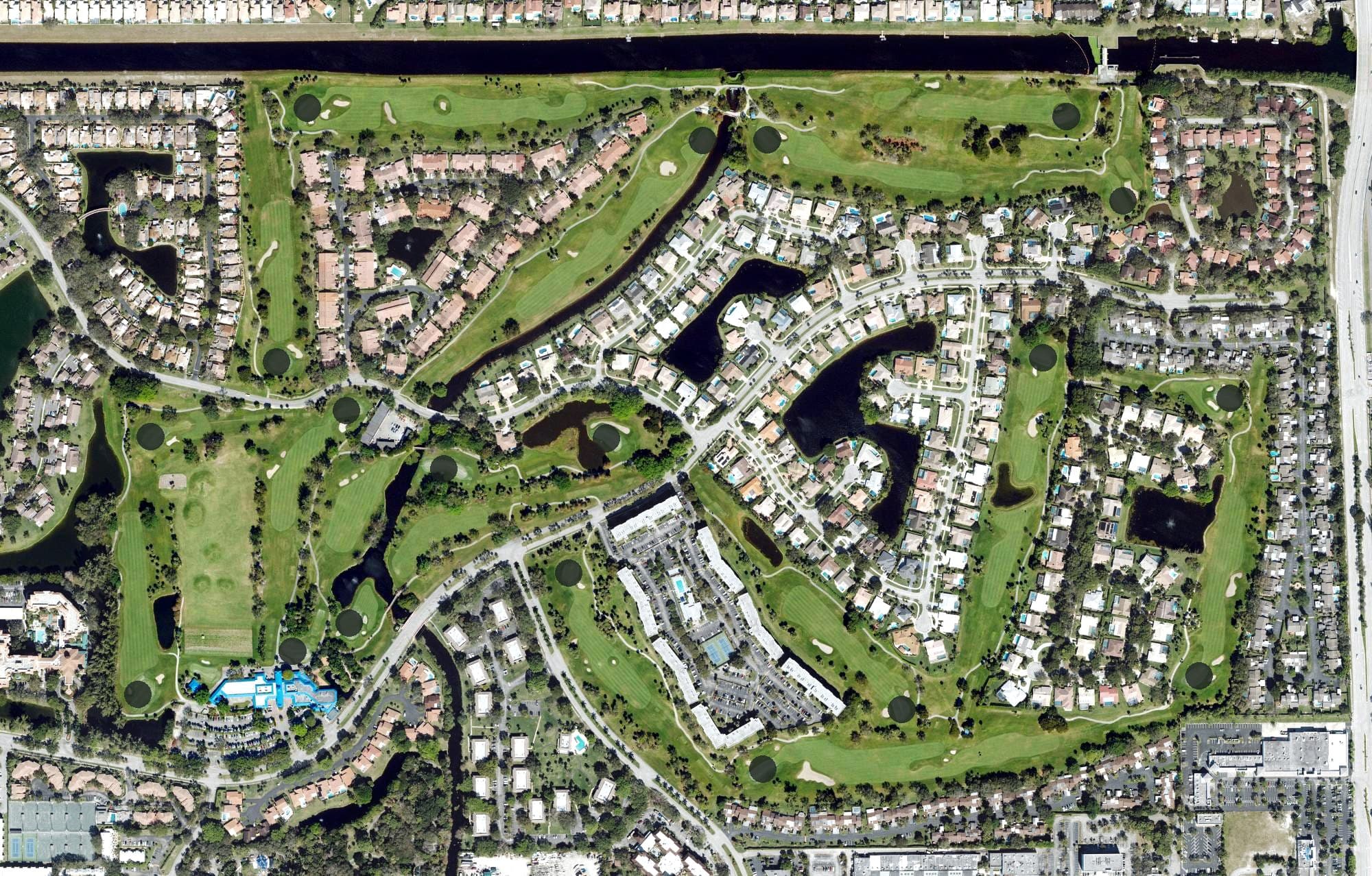 Aerial view of Deer Creek Golf Club, FL, with its hole routing marked