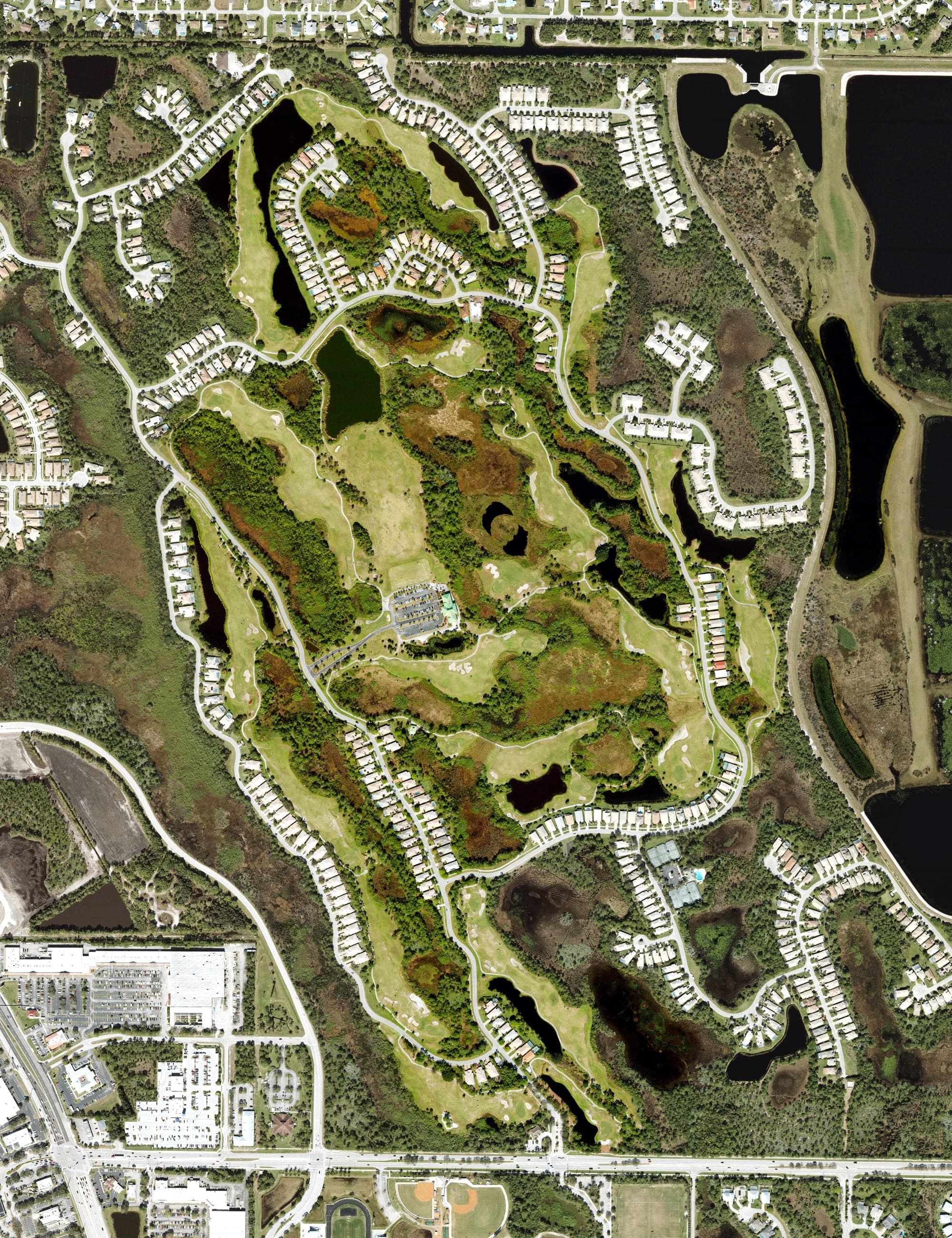 Aerial view of Eagle Marsh Golf Club, FL, with its hole routing marked