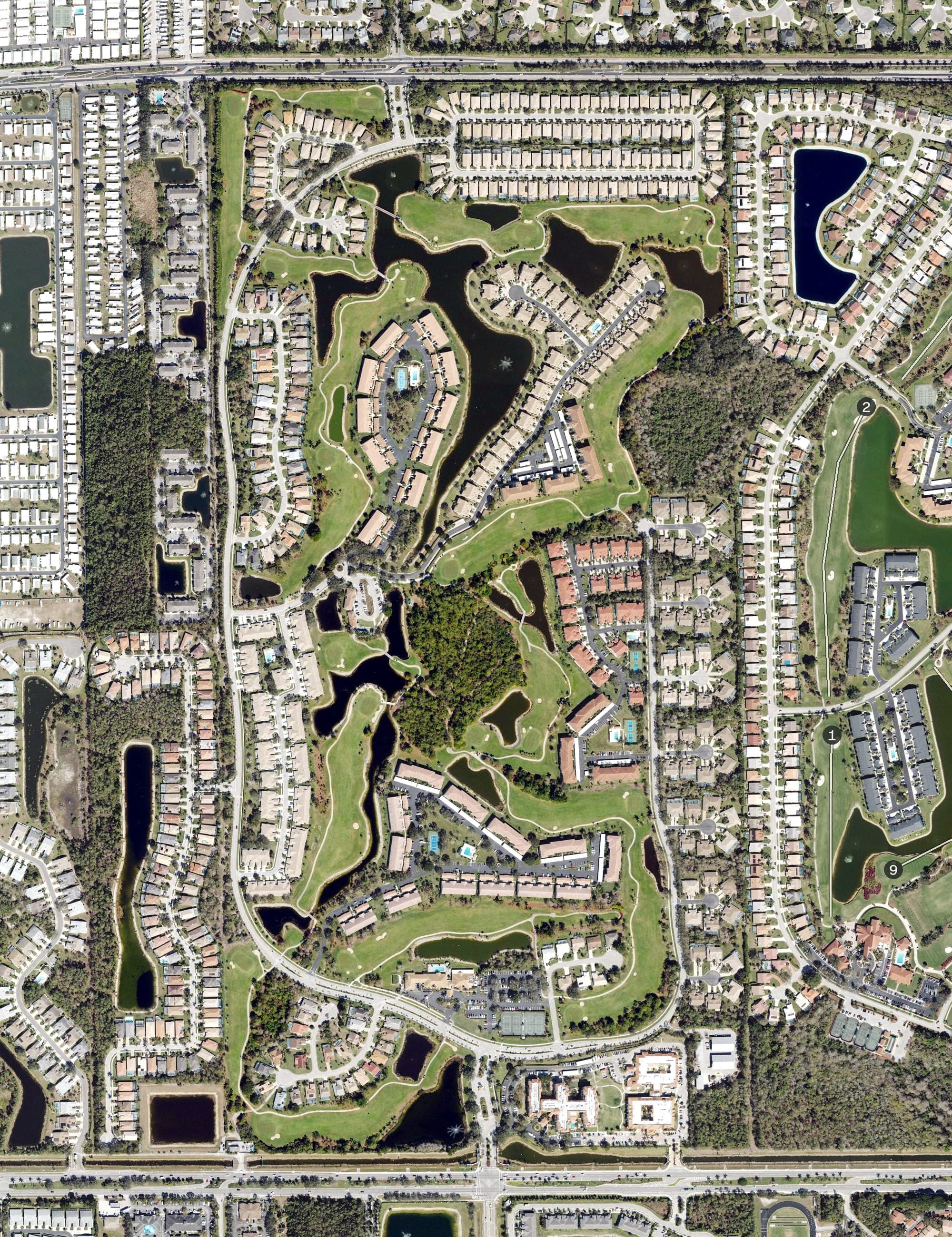 Aerial view of Glen Eagle Golf & Country Club, FL, with its hole routing marked