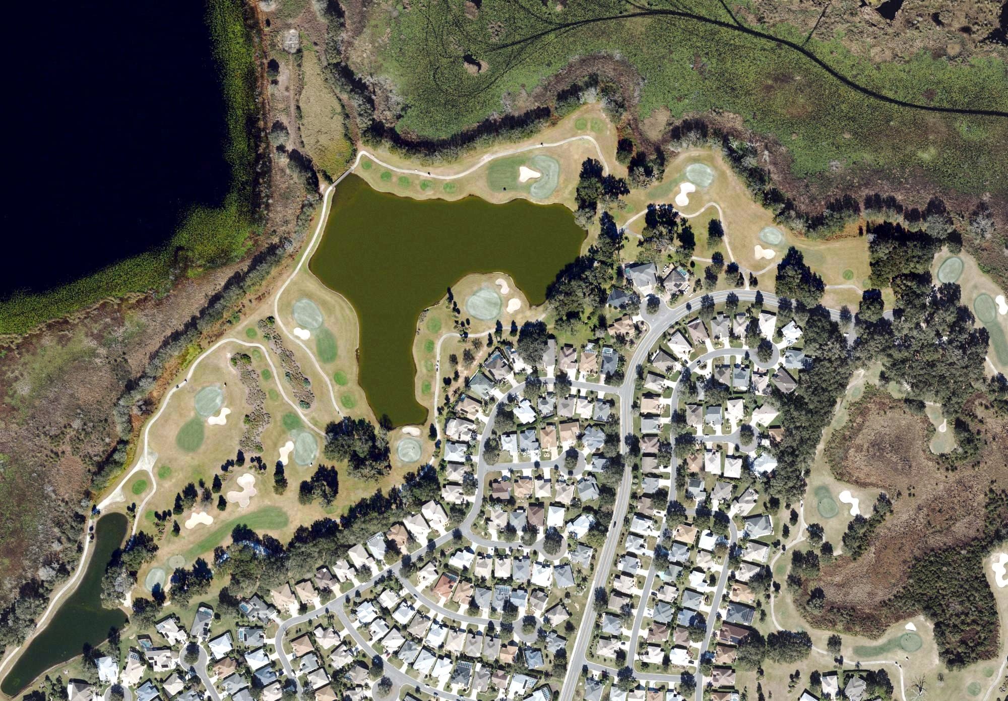 Aerial view of Heron Golf Course (The Villages), FL, with its hole routing marked