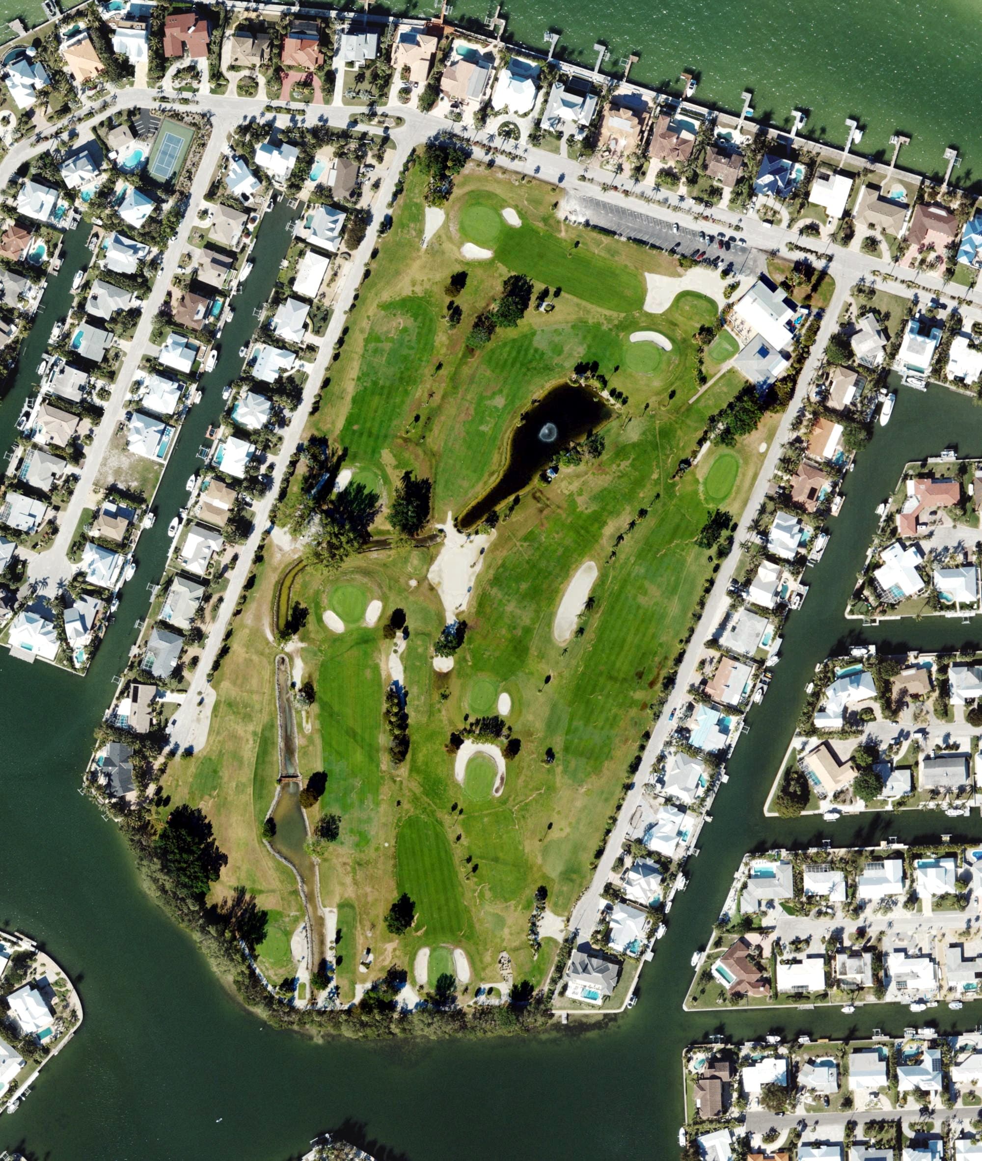 Aerial view of Key Royale Golf Club, FL, with its hole routing marked