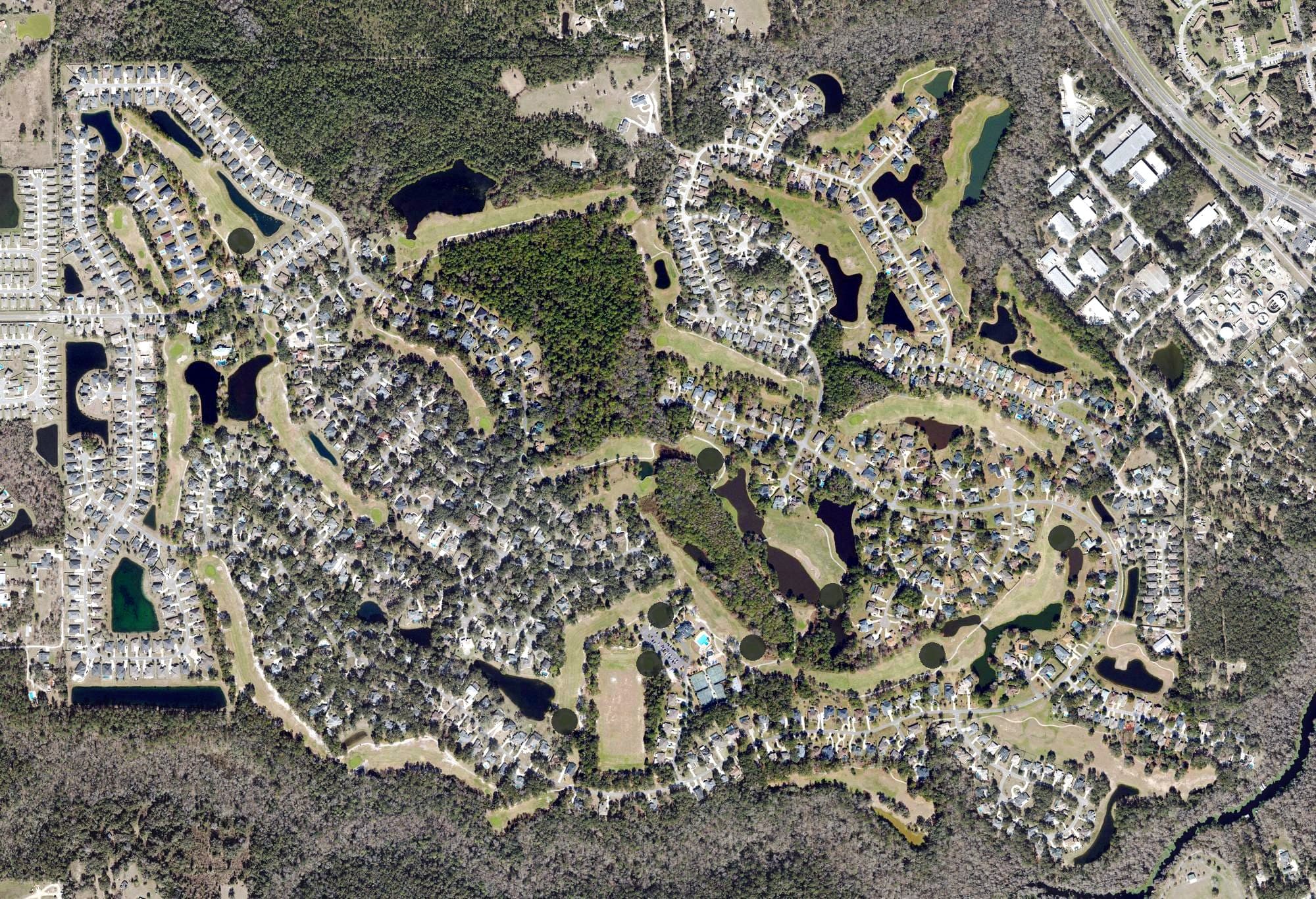 Aerial view of Magnolia Point Golf and Country Club, FL, with its hole routing marked