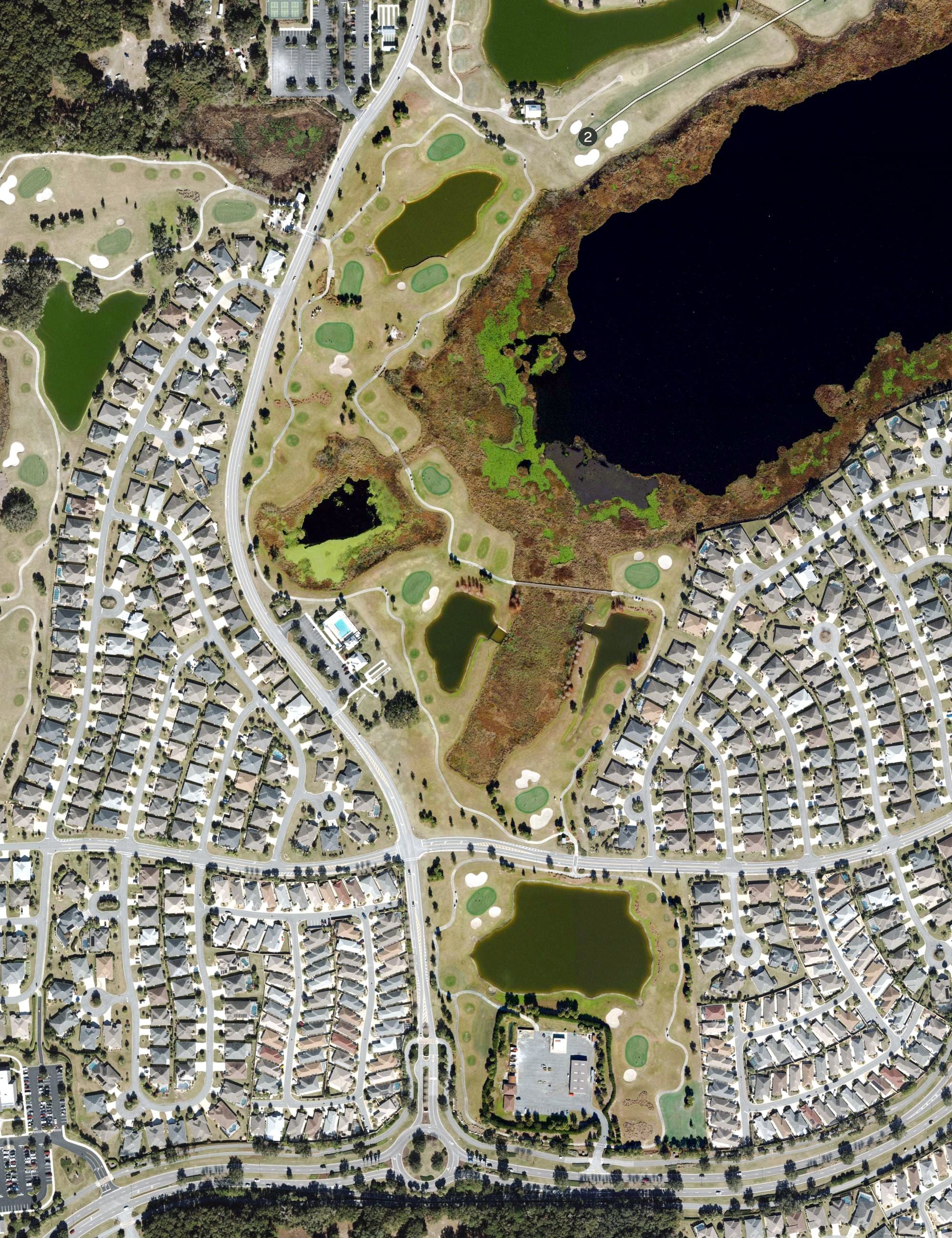 Aerial view of Mangrove Golf Course (The Villages), FL, with its hole routing marked