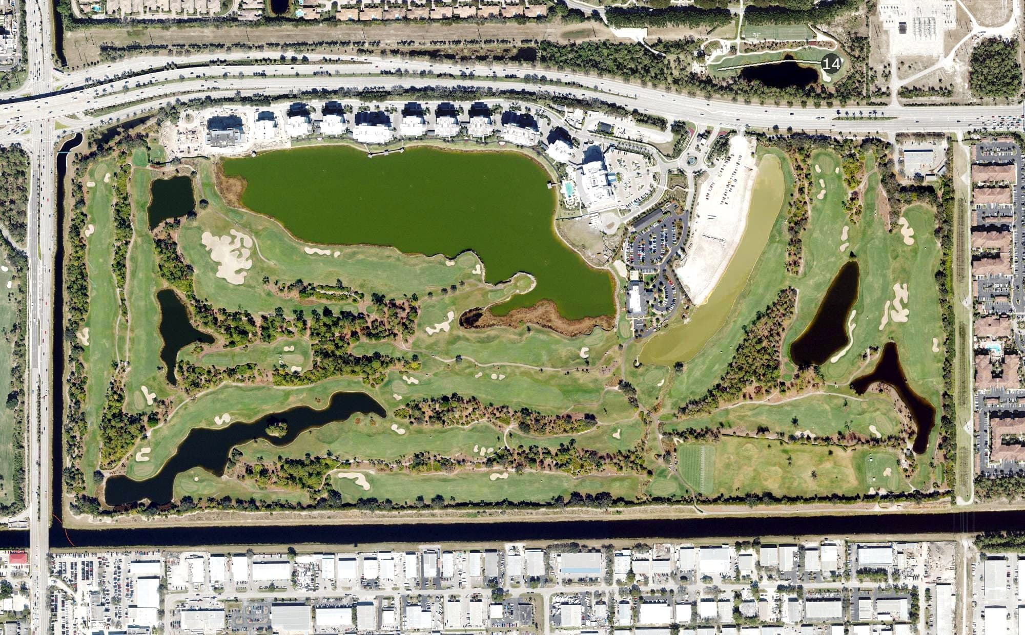 Aerial view of Naples Grande Golf Club, FL, with its hole routing marked