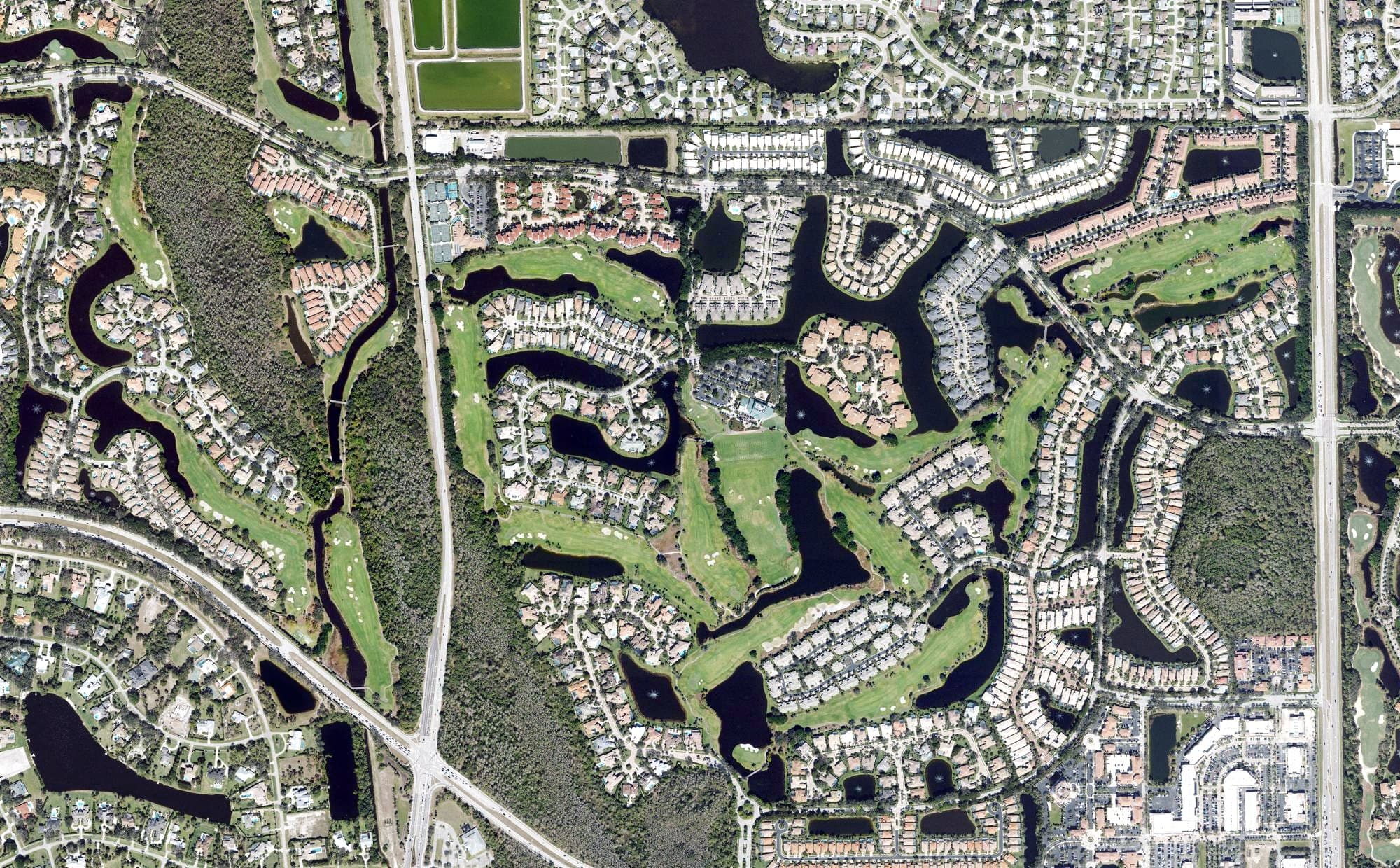 Aerial view of Pelican Marsh Golf Club, FL, with its hole routing marked