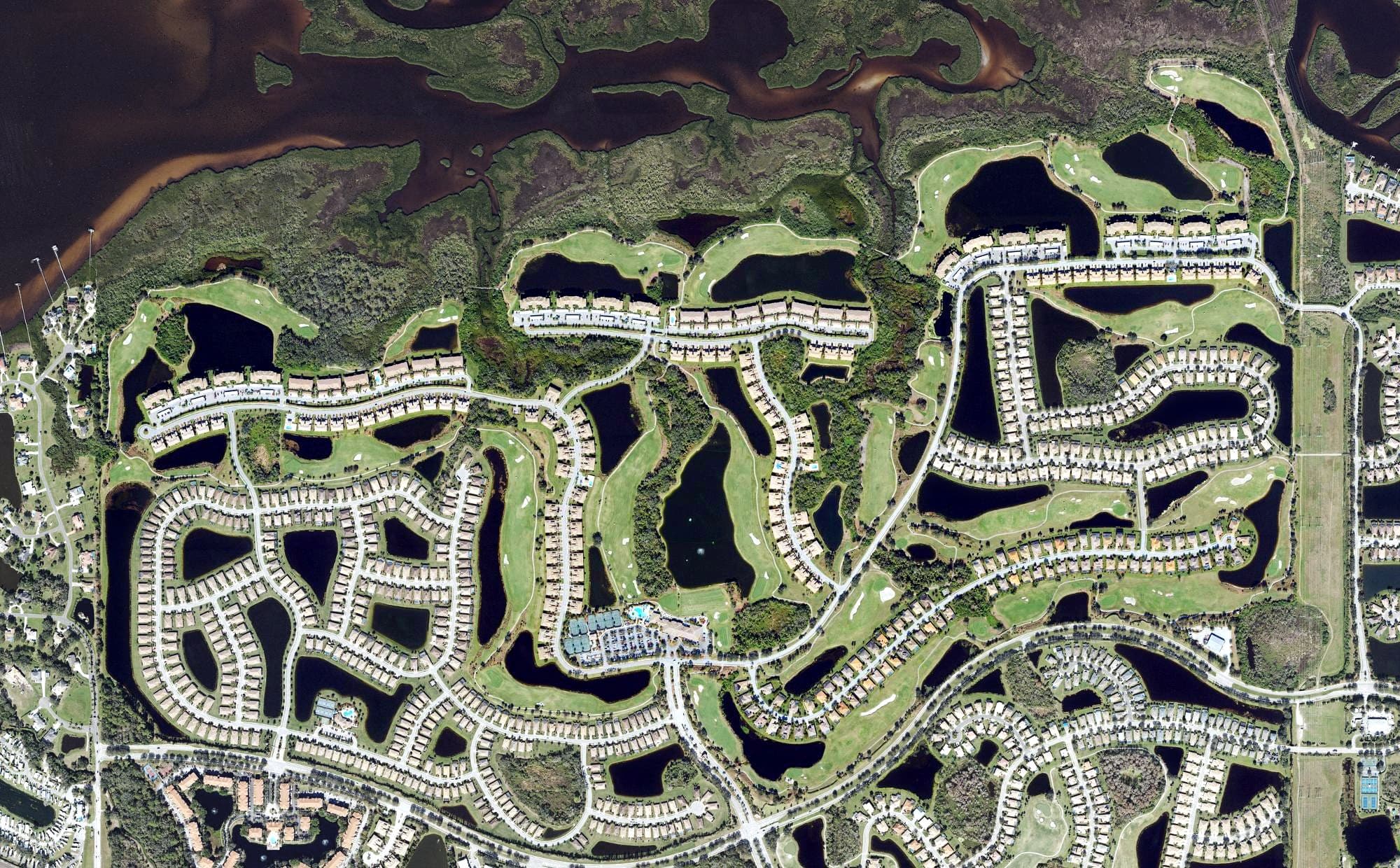 Aerial view of River Strand Golf & Country Club, FL, with its hole routing marked