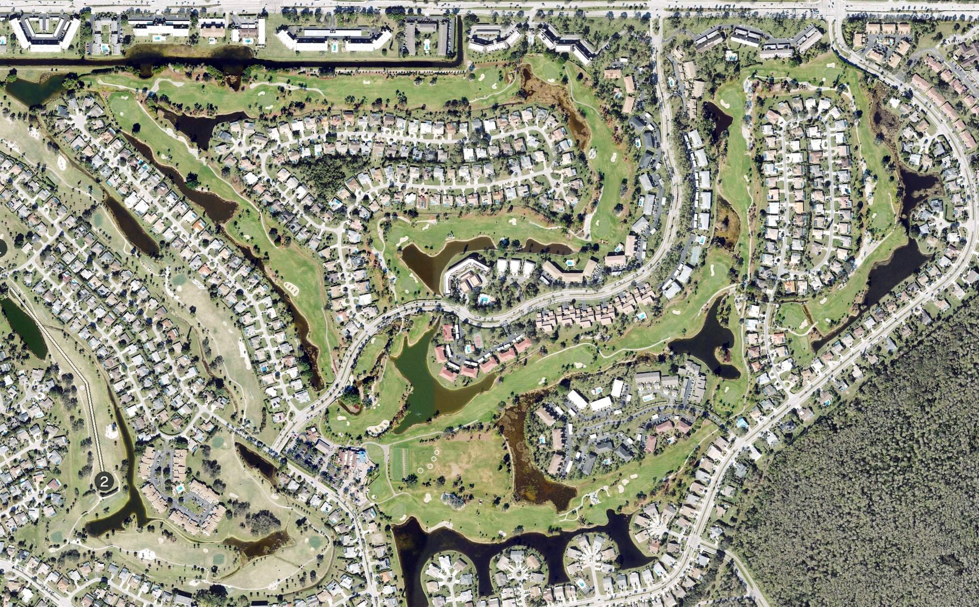 Aerial view of Royal Palm Country Club, FL, with its hole routing marked