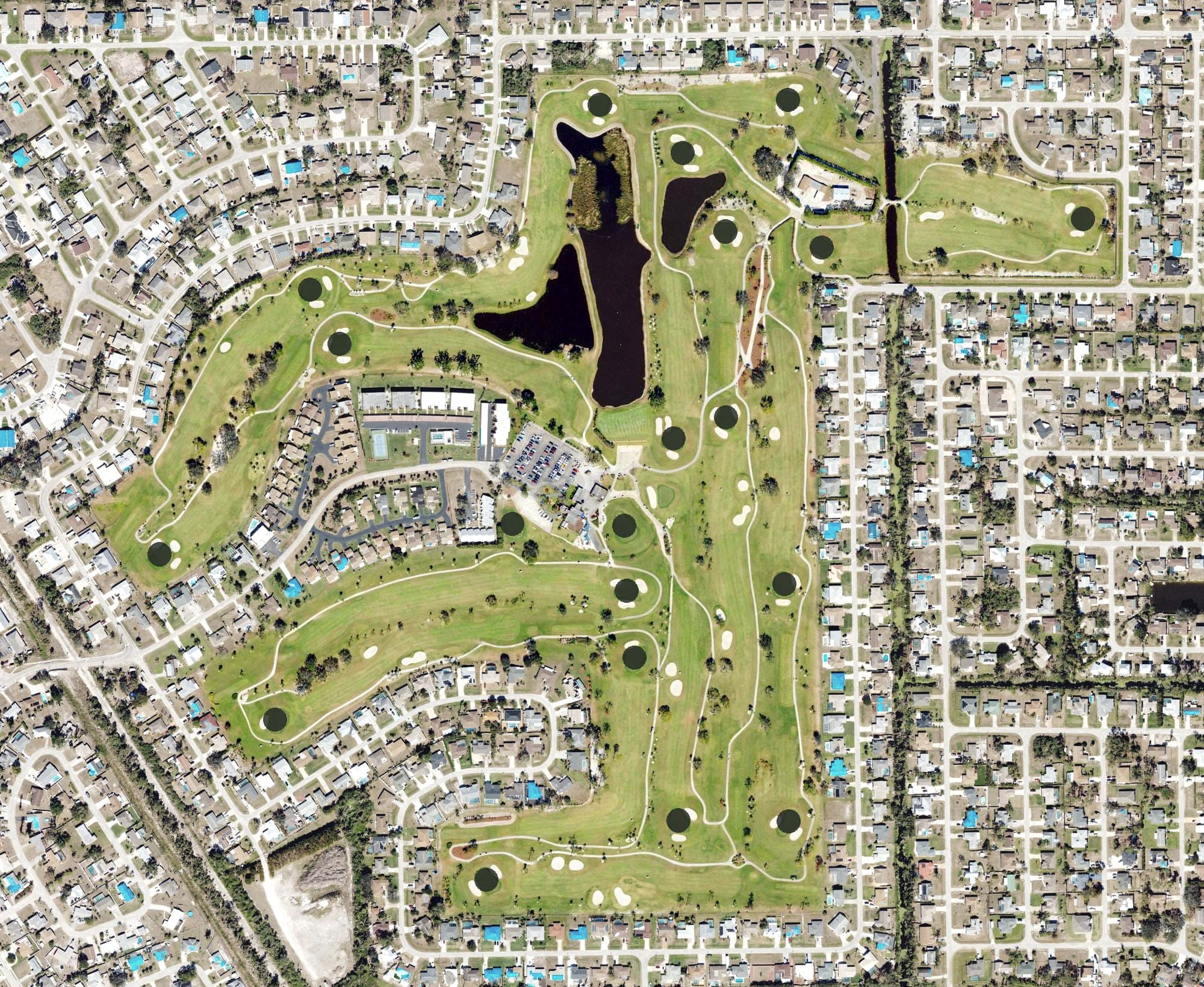 Aerial view of San Carlos Golf Club, FL, with its hole routing marked