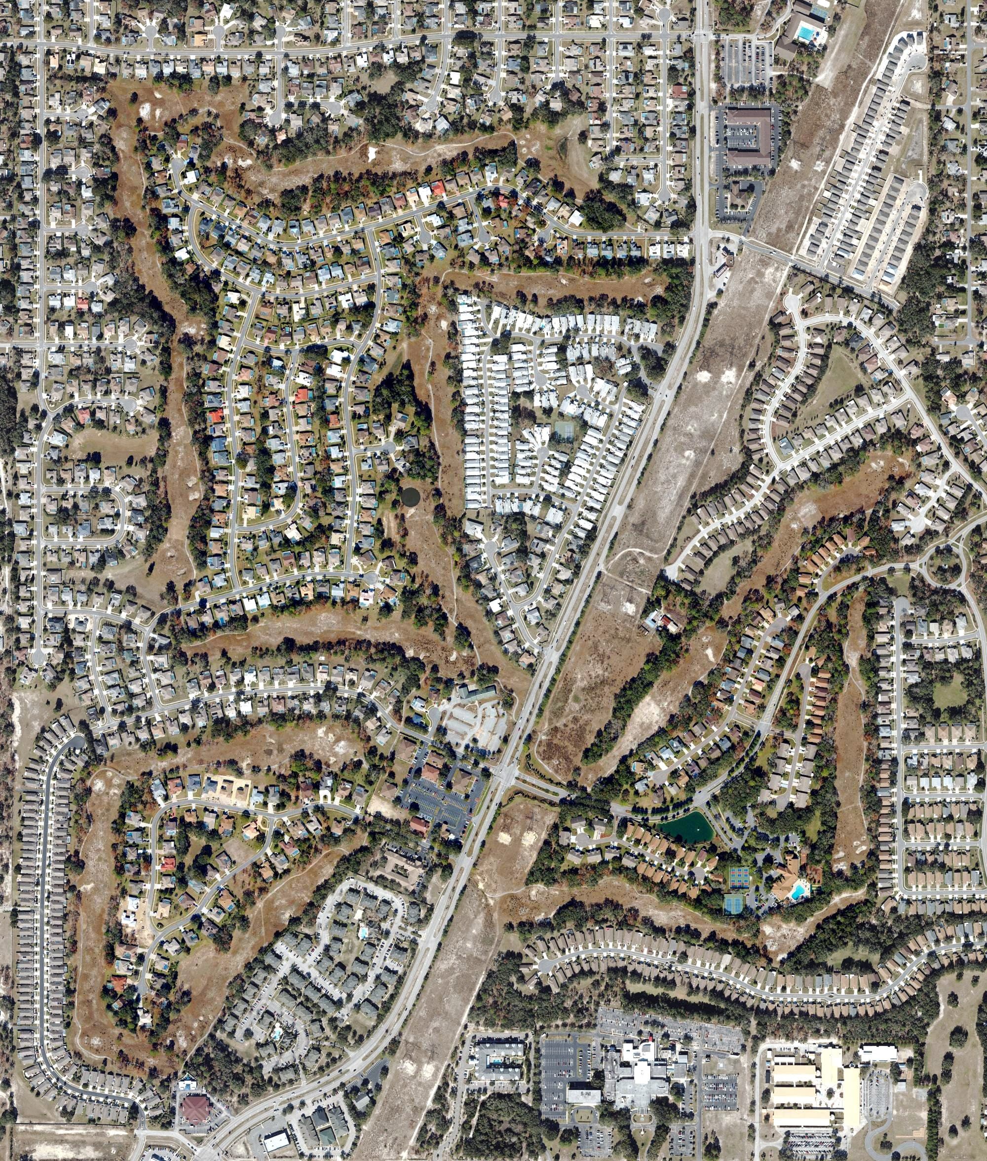 Aerial view of Seven Hills Golfers Club, FL, with its hole routing marked