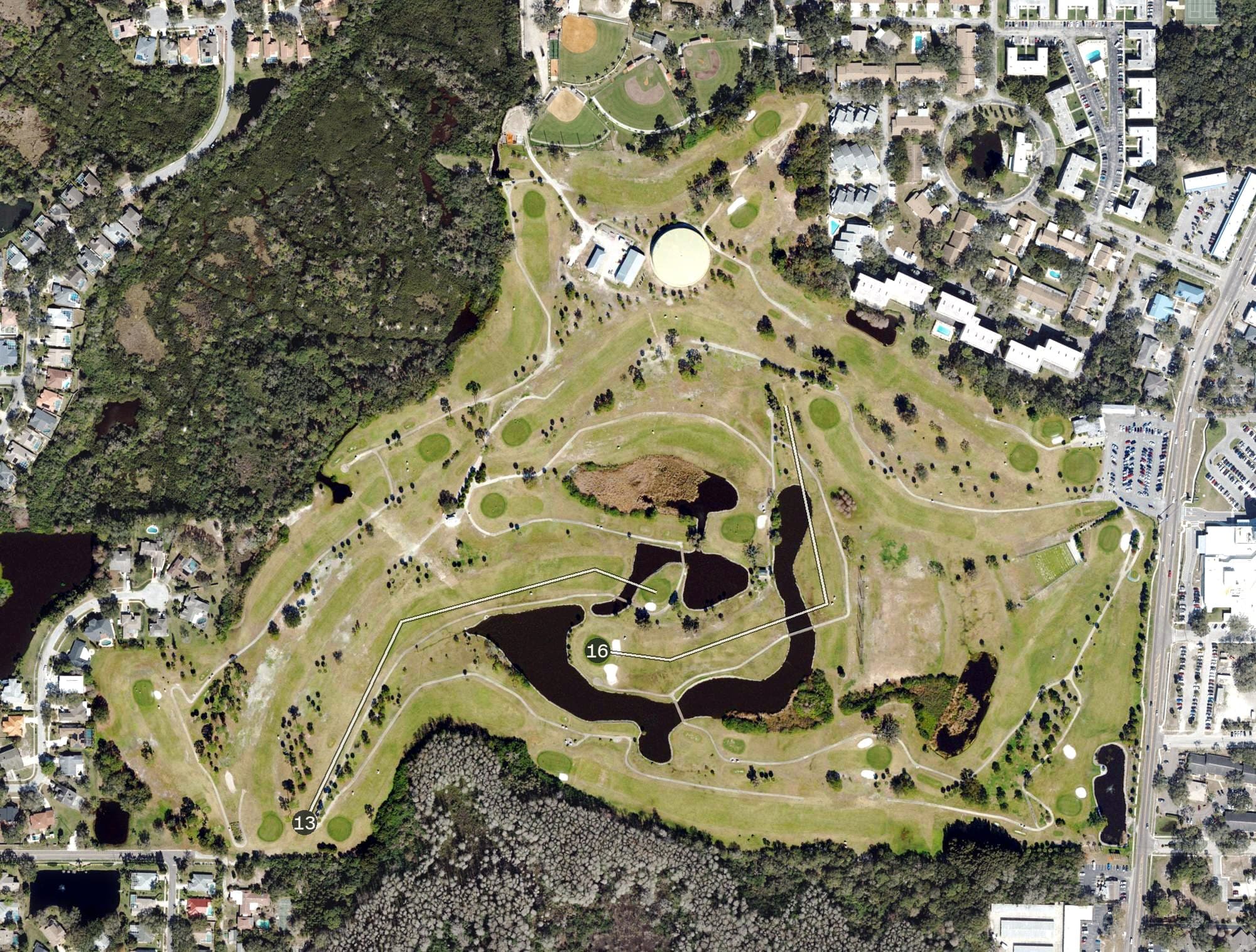 Aerial view of Tarpon Springs Golf Course, FL, with its hole routing marked