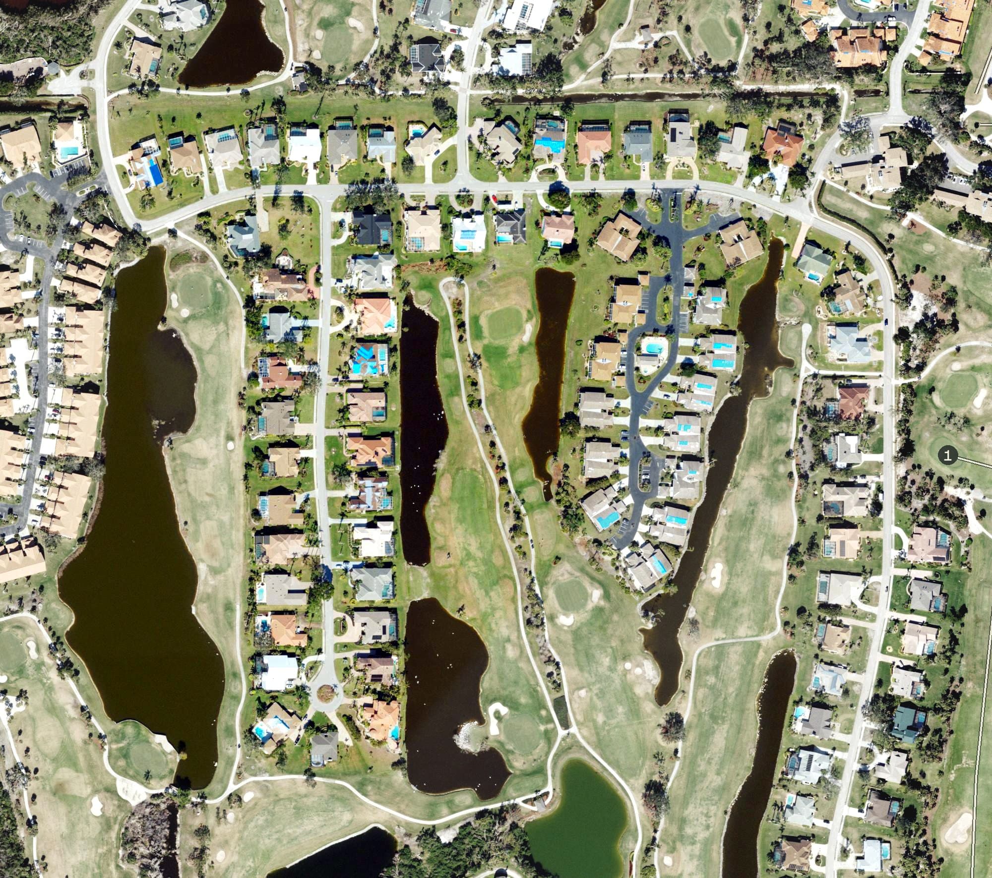 Aerial view of The Forest Country Club, FL, with its hole routing marked