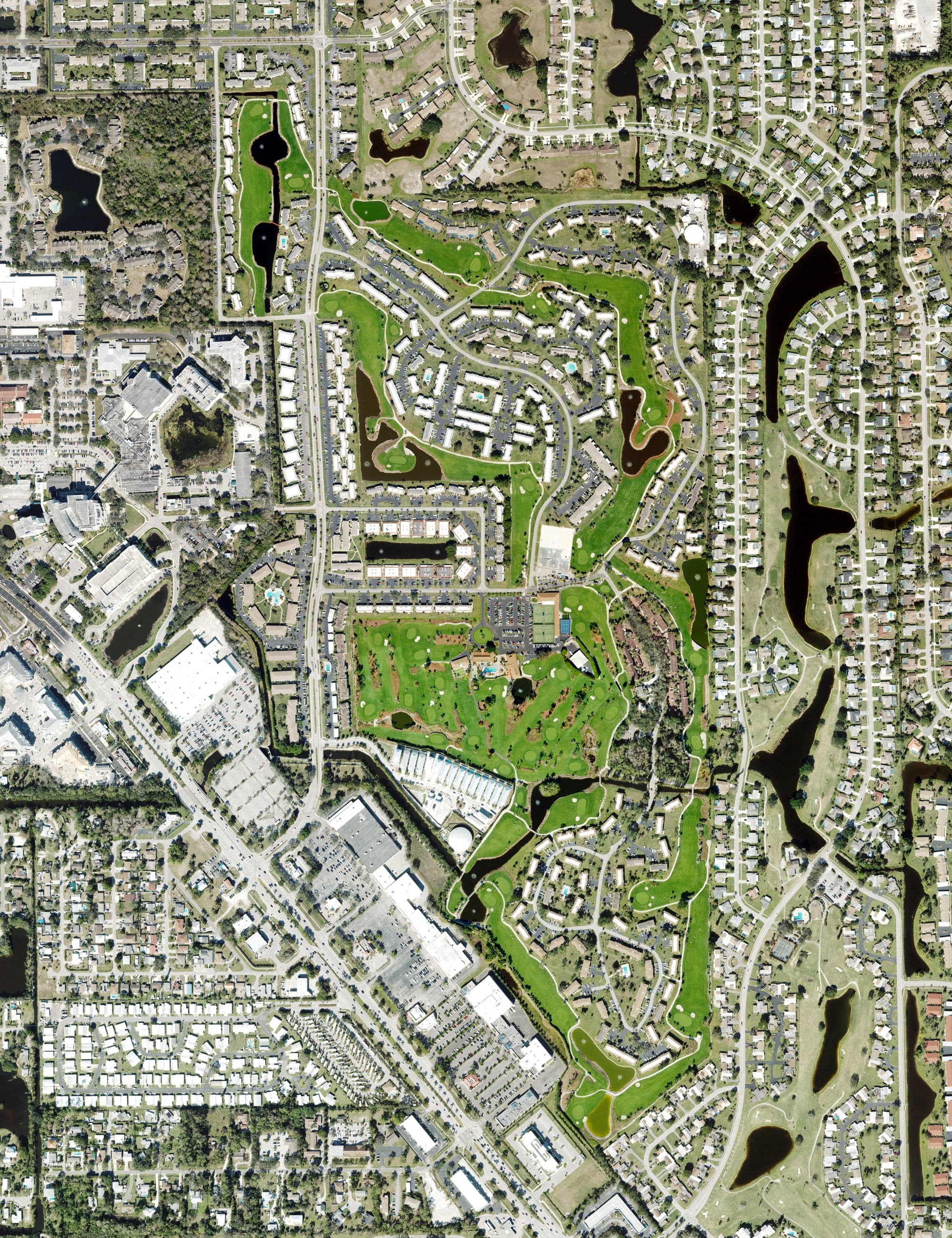 Aerial view of The Glades Golf & Country Club, FL, with its hole routing marked
