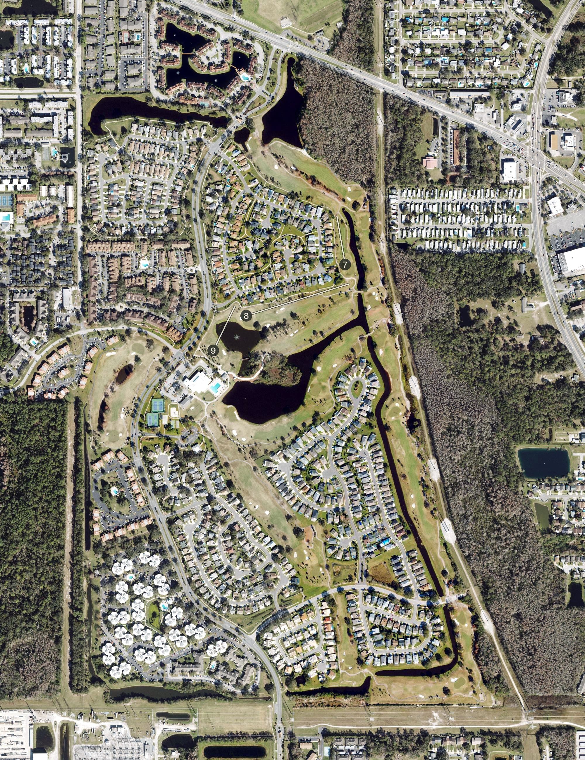 Aerial view of Ventura Country Club, FL, with its hole routing marked