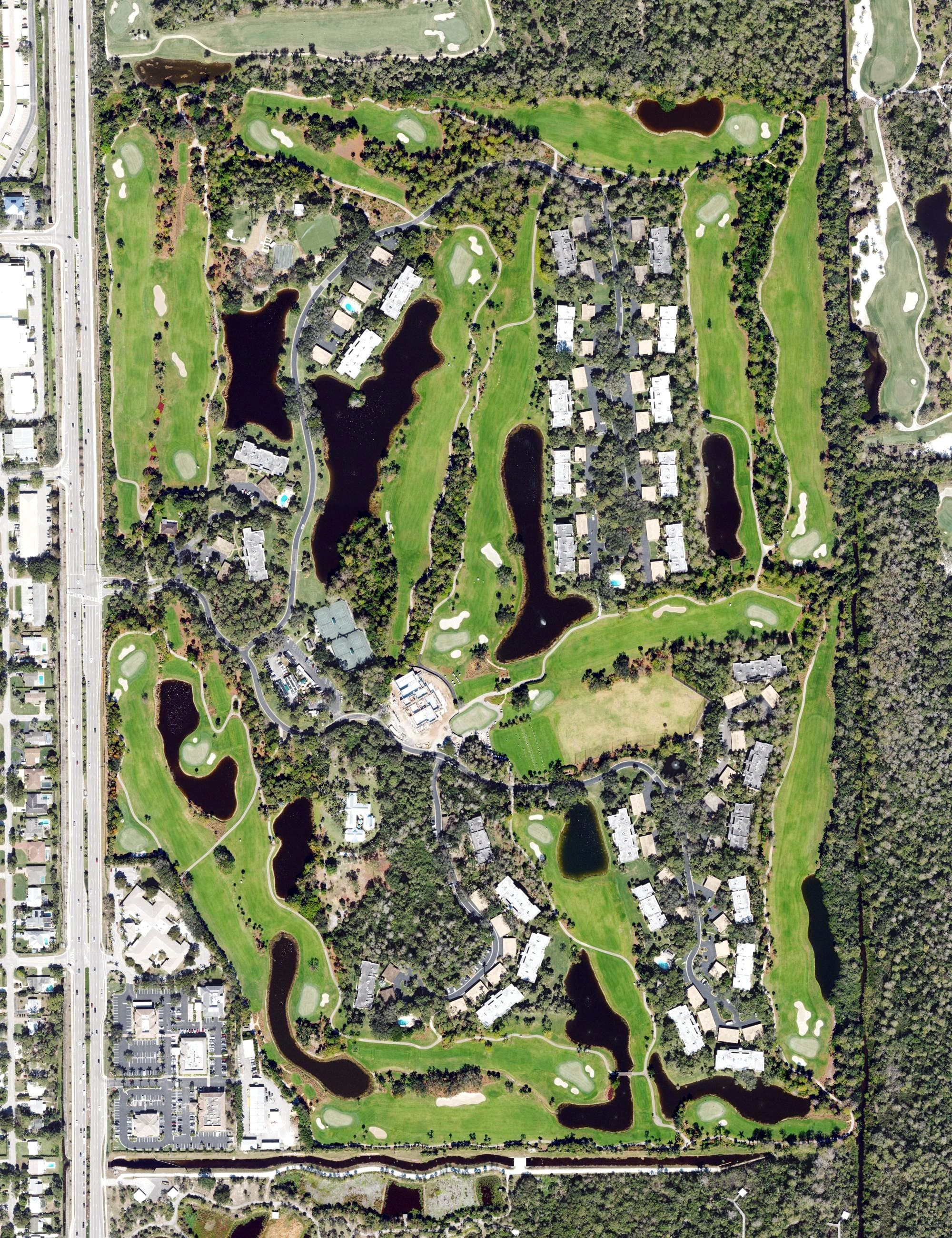Aerial view of Wilderness Country Club, FL, with its hole routing marked