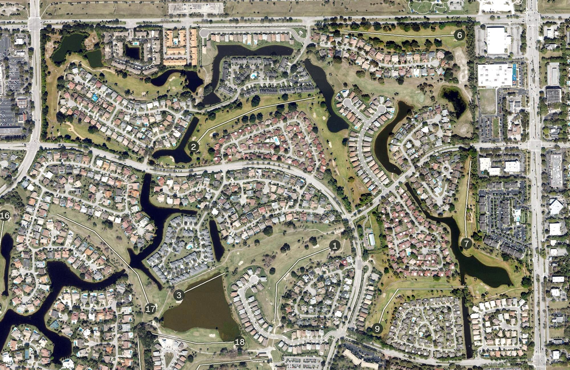 Aerial view of Woodmont Country Club- Pines 9, FL, with its hole routing marked