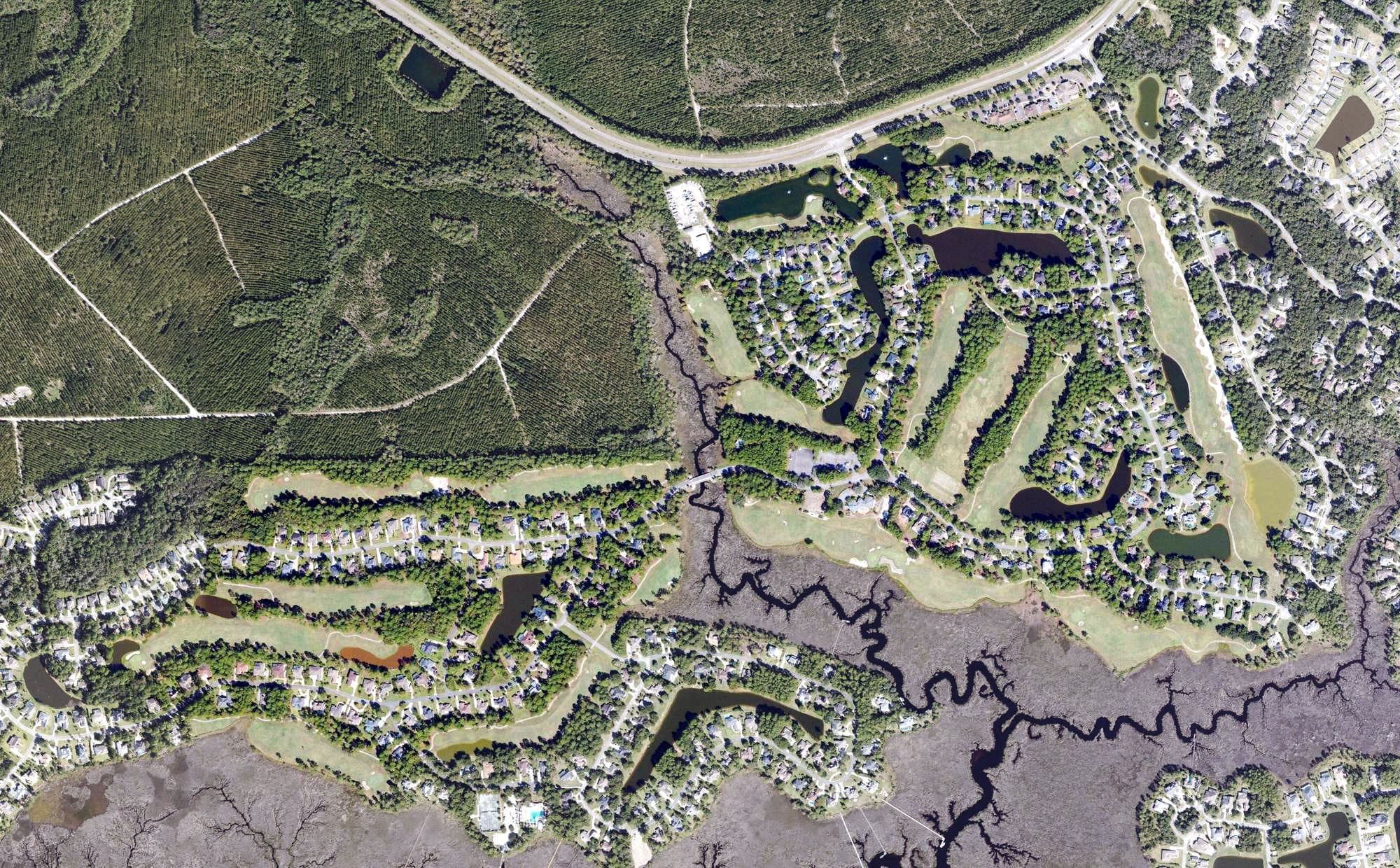 Aerial view of The Club at Osprey Cove, GA, with its hole routing marked