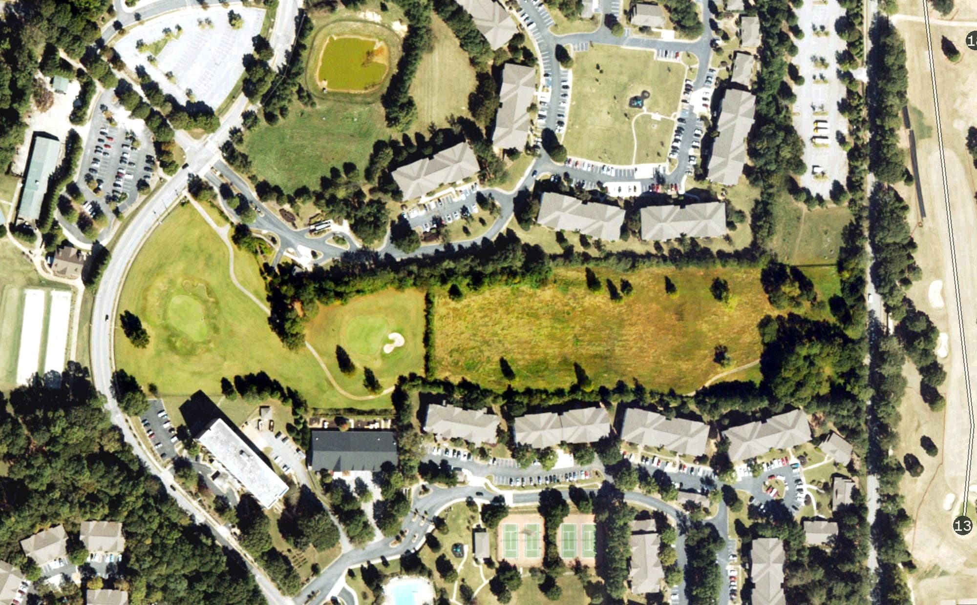 Aerial view of The Villages of East Lake, GA, with its hole routing marked