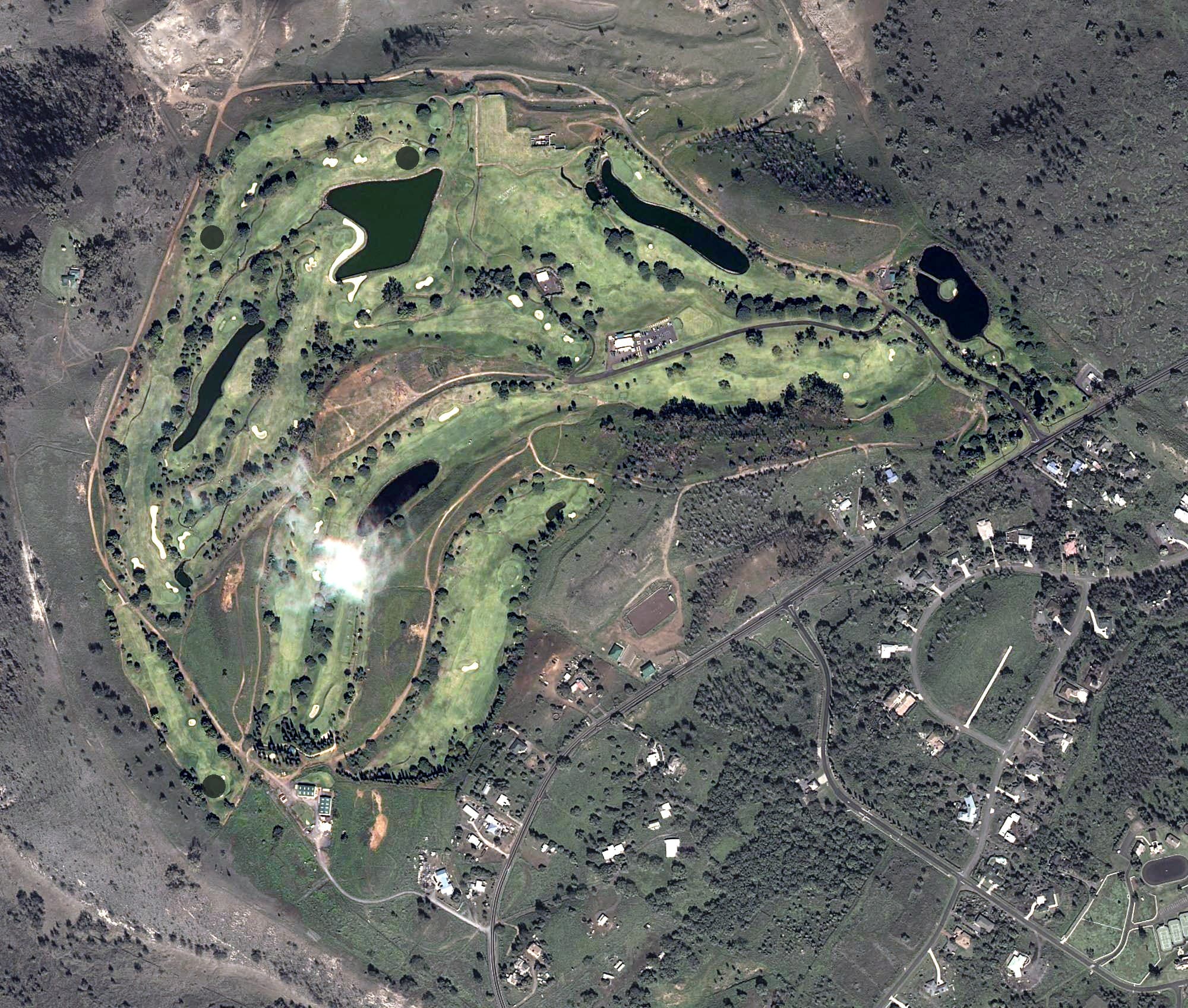 Aerial view of Makani Golf Club, HI, with its hole routing marked