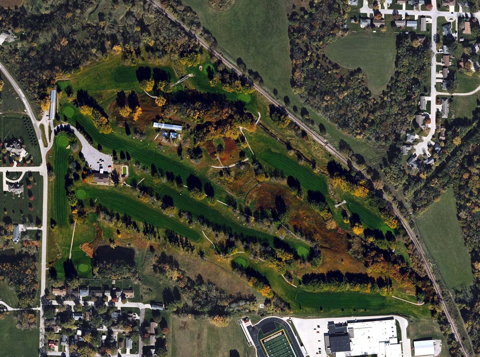 Aerial view of Cherokee Golf and Country Club, IA, with its hole routing marked