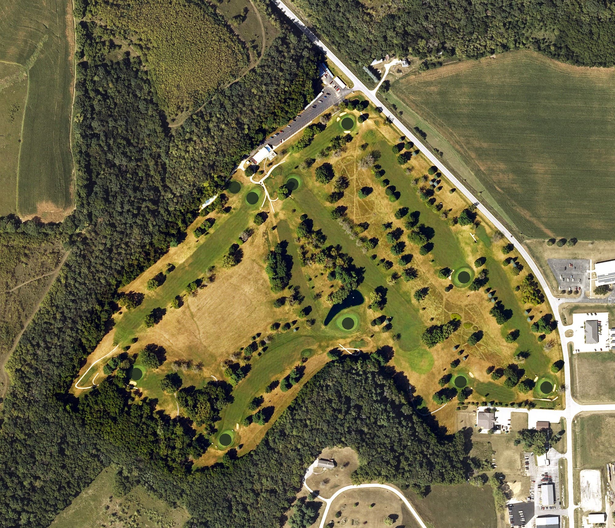 Aerial view of Elkader Golf and Country Club, IA, with its hole routing marked