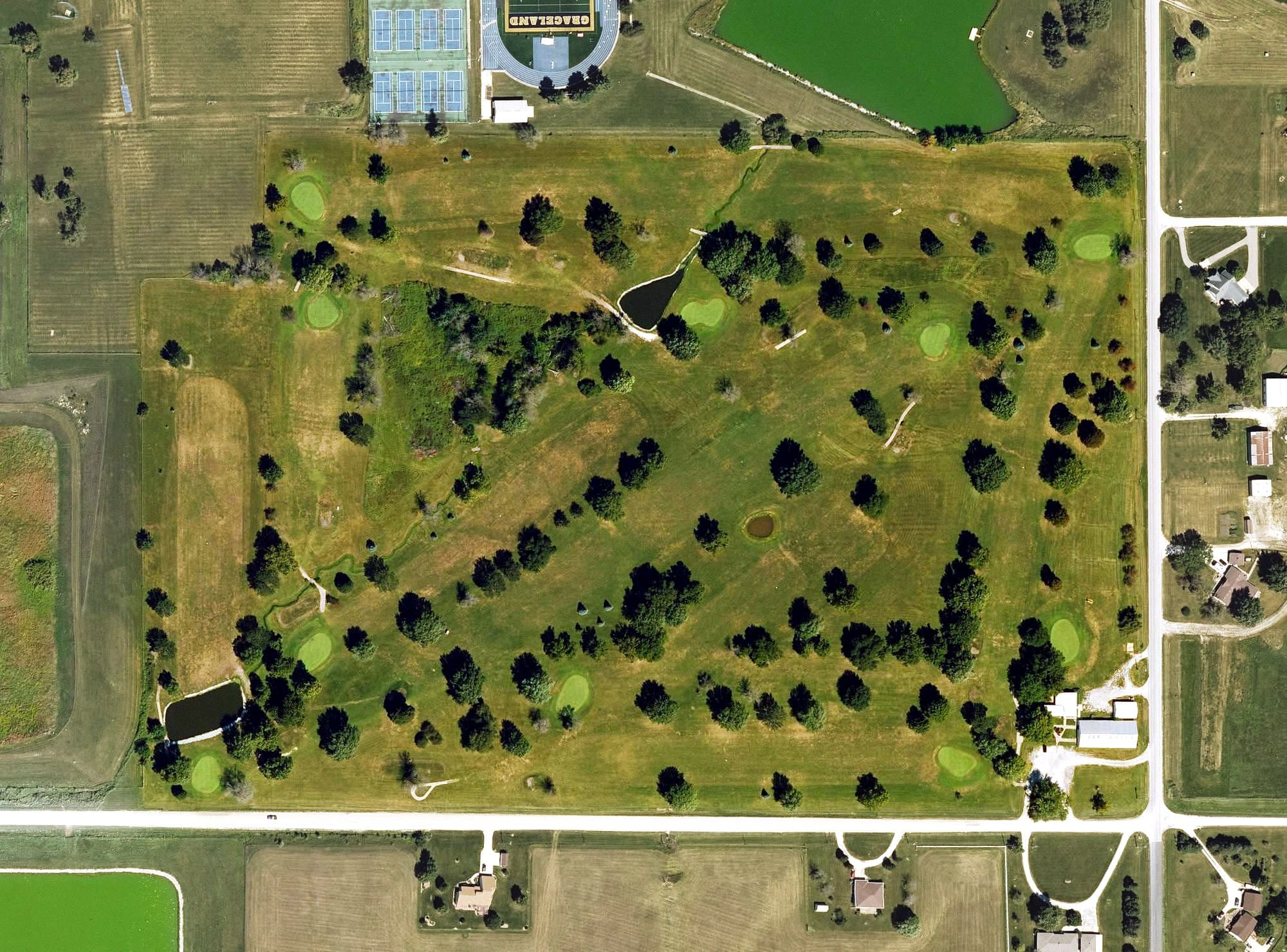 Aerial view of Lamoni Golf and Country Club, IA, with its hole routing marked