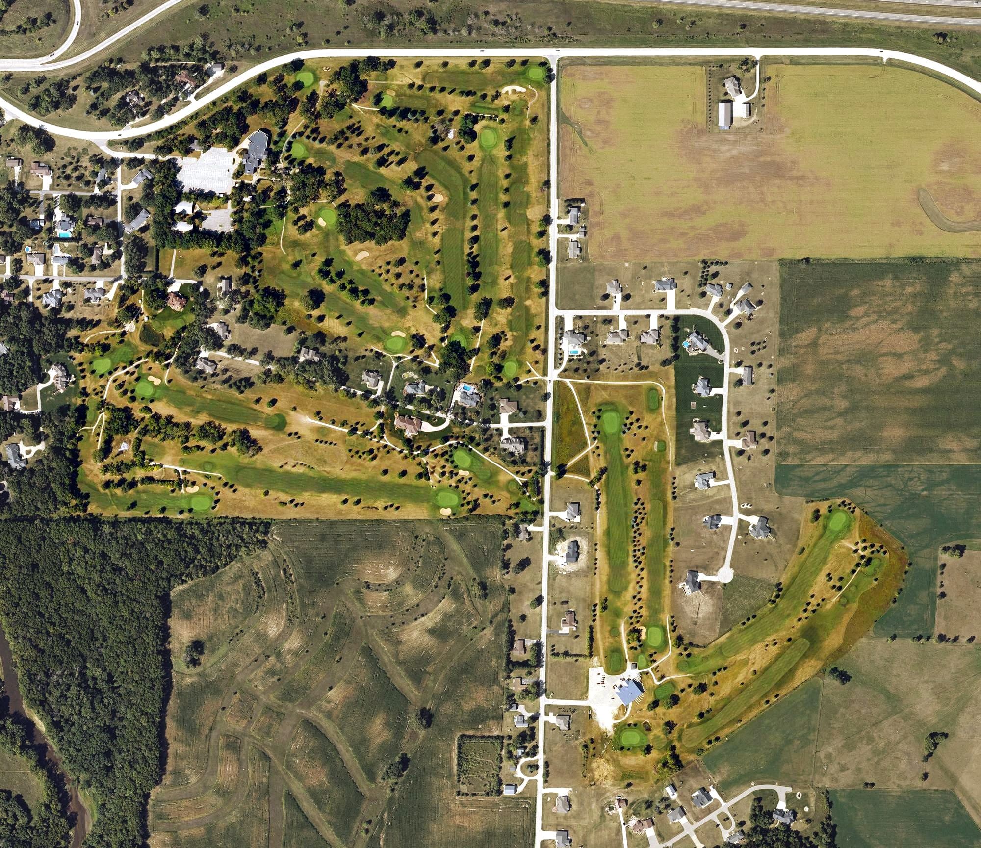 Aerial view of Manchester Golf and Country Club, IA, with its hole routing marked