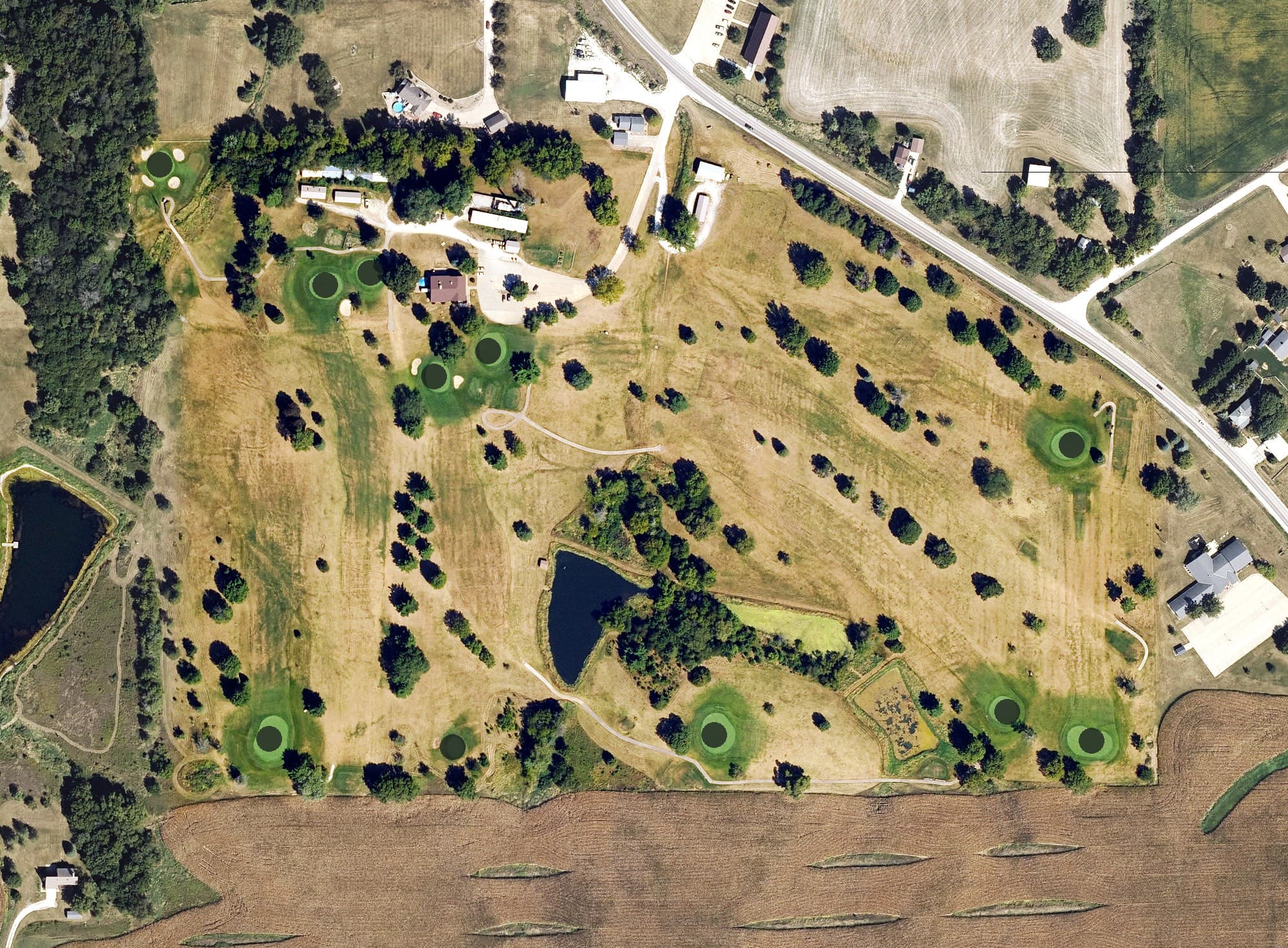 Aerial view of Pine Knolls Country Club, IA, with its hole routing marked