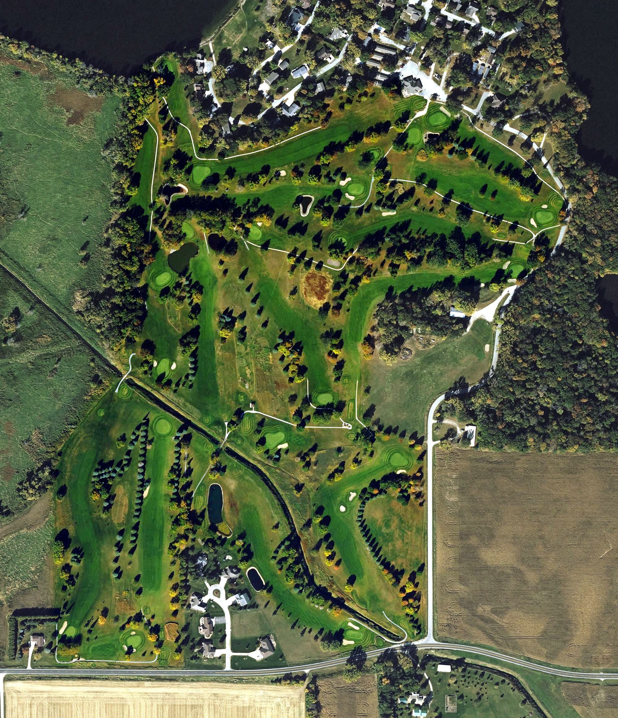 Aerial view of Rice Lake Golf and Country Club, IA, with its hole routing marked
