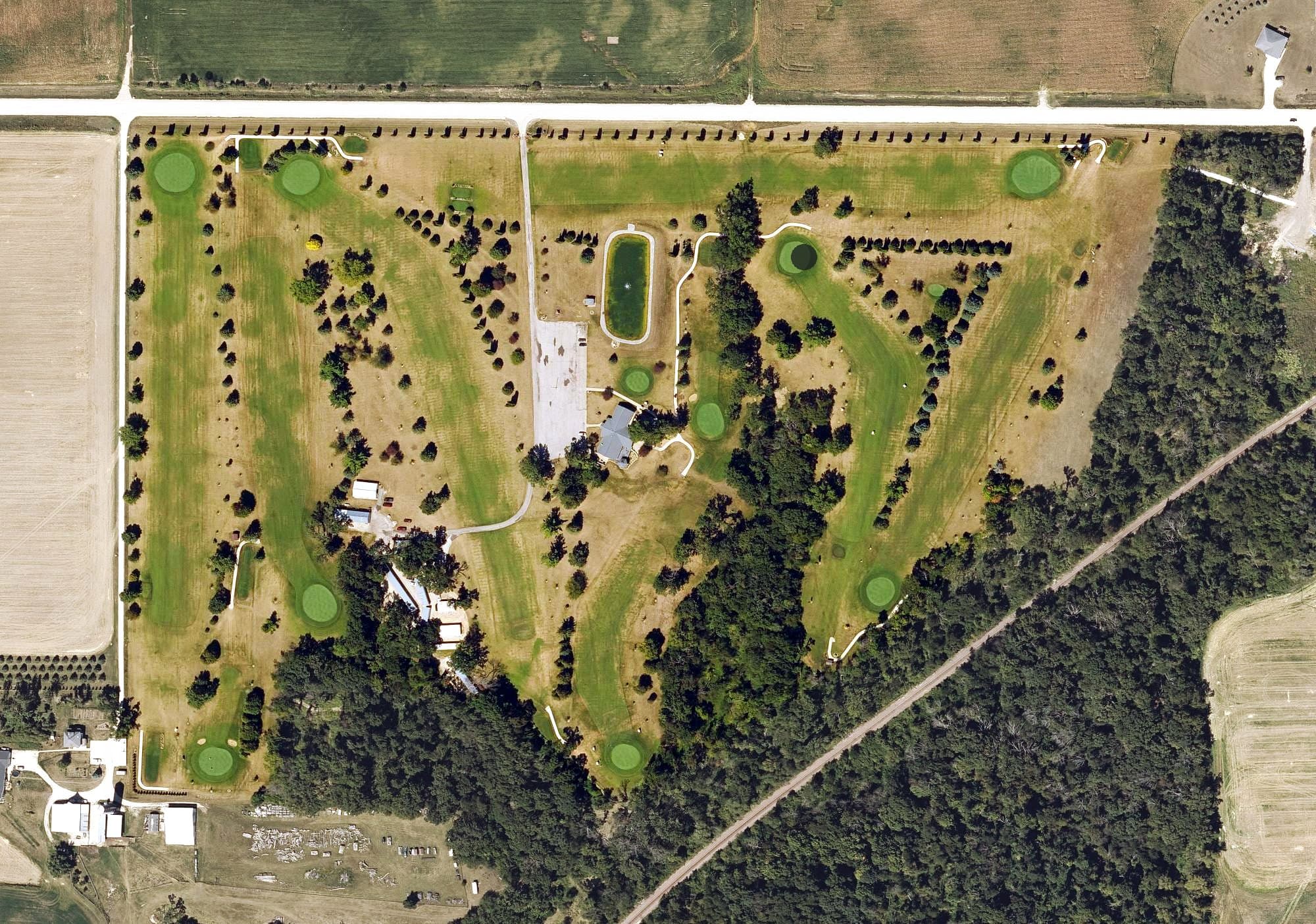 Aerial view of South Winn Golf & Country Club, IA, with its hole routing marked