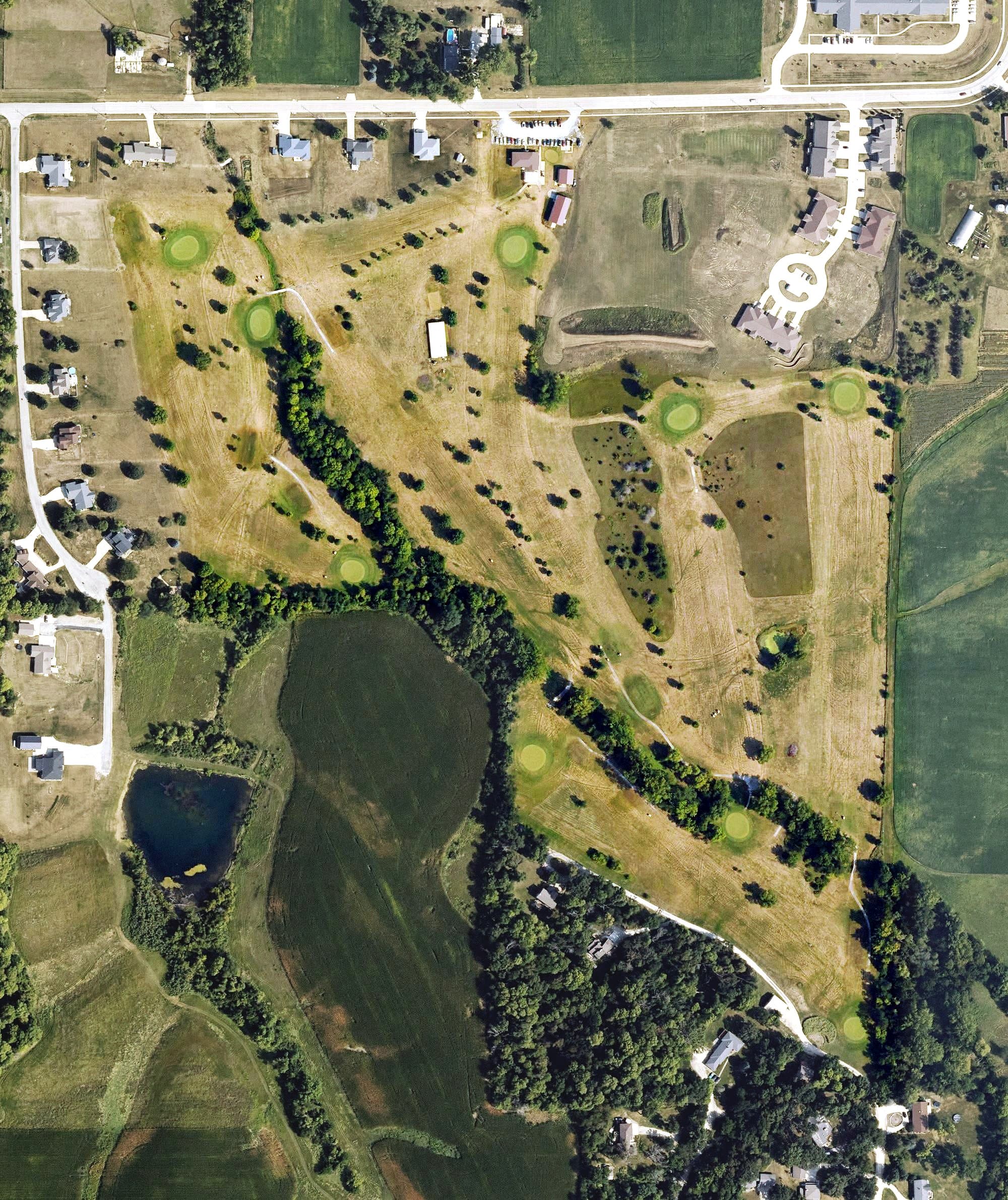 Aerial view of Wandering Creek Golf Course, IA, with its hole routing marked