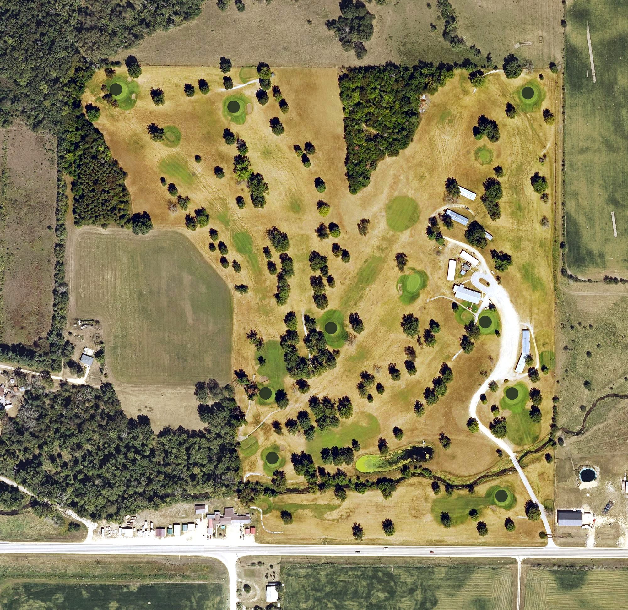 Aerial view of Wapsi Oaks Country Club, IA, with its hole routing marked