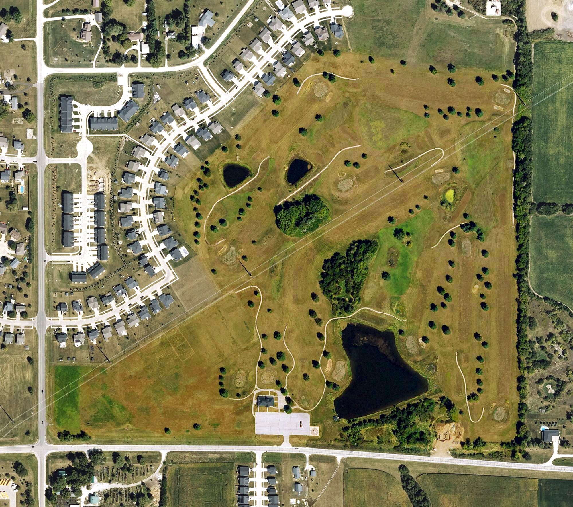 Aerial view of Warrior Run Golf Course, IA, with its hole routing marked