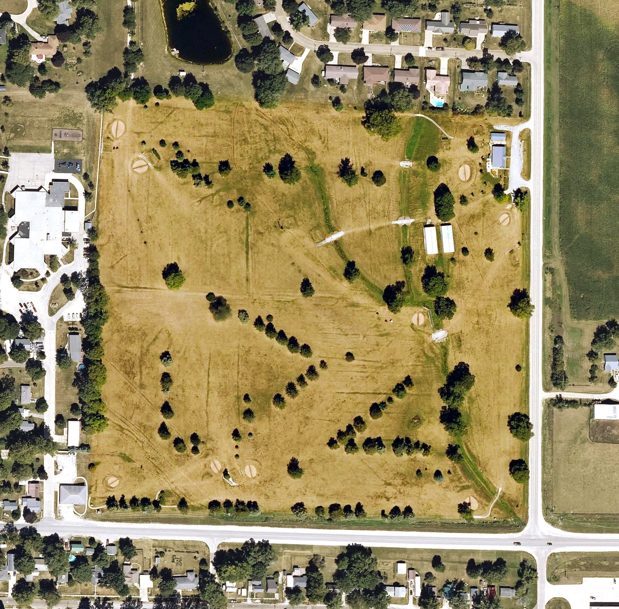 Aerial view of Wellman Golf Course, IA, with its hole routing marked
