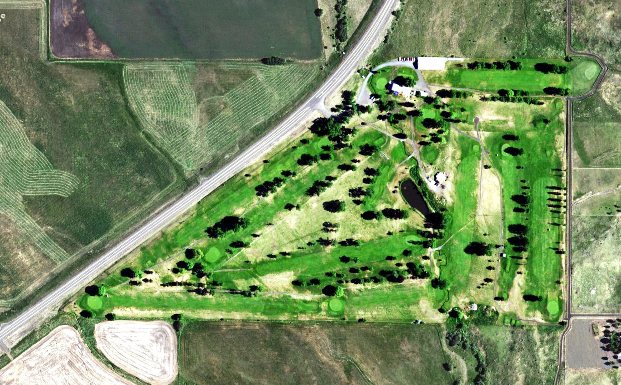 Aerial view of Grangeville Golf and Country Club, ID, with its hole routing marked