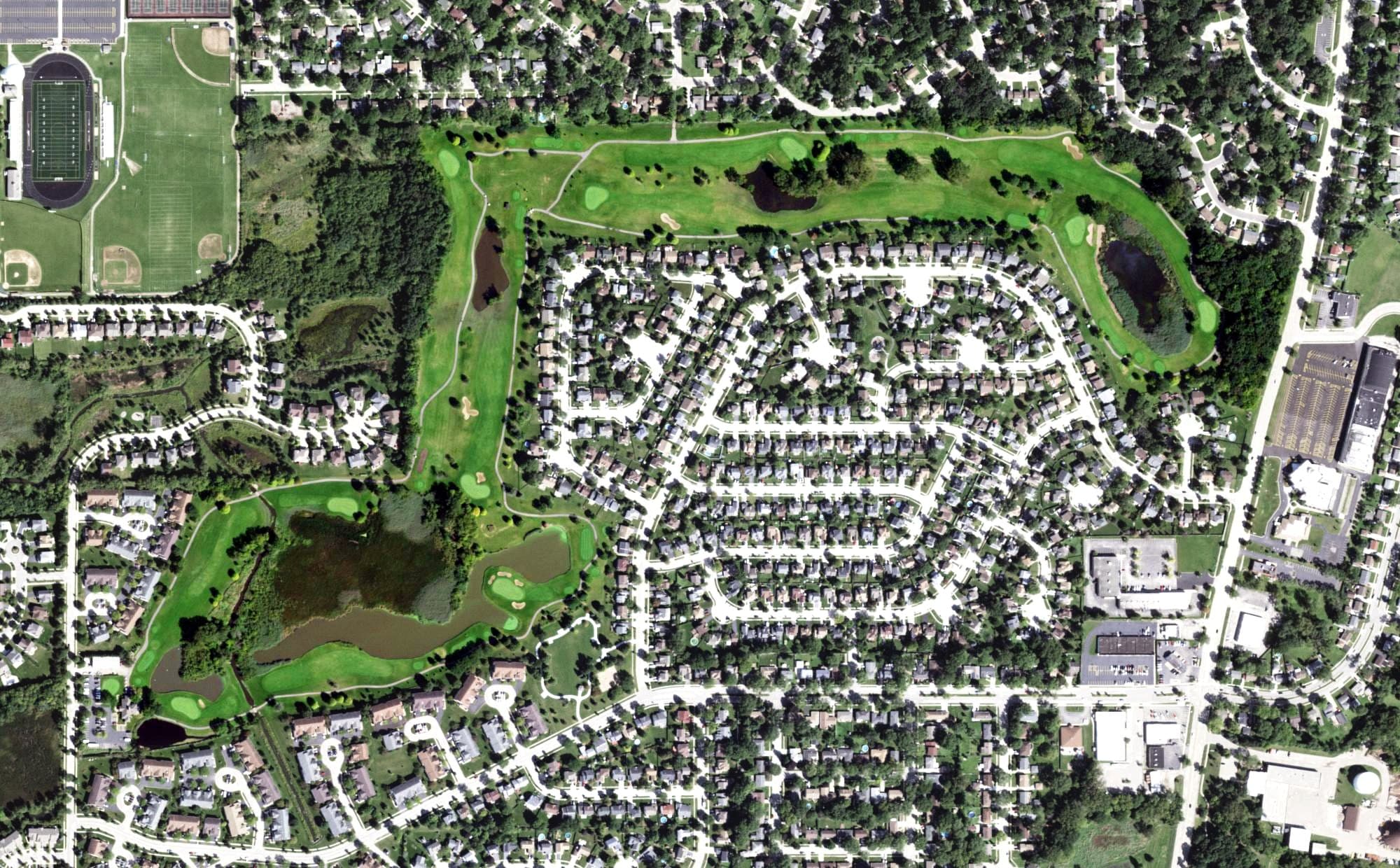 Aerial view of Streamwood Oaks Golf Club, IL, with its hole routing marked