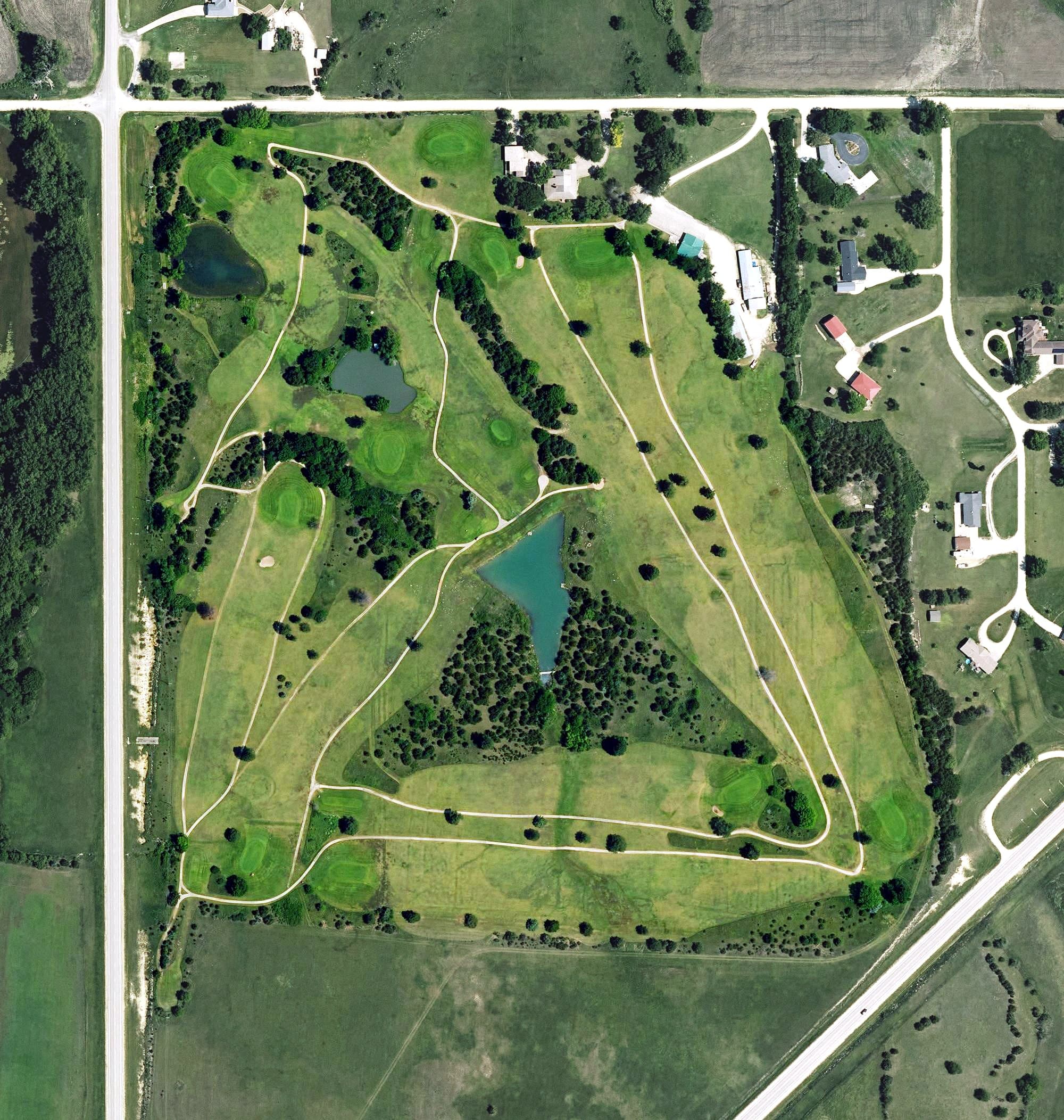 Aerial view of Herington Country Club, KS, with its hole routing marked
